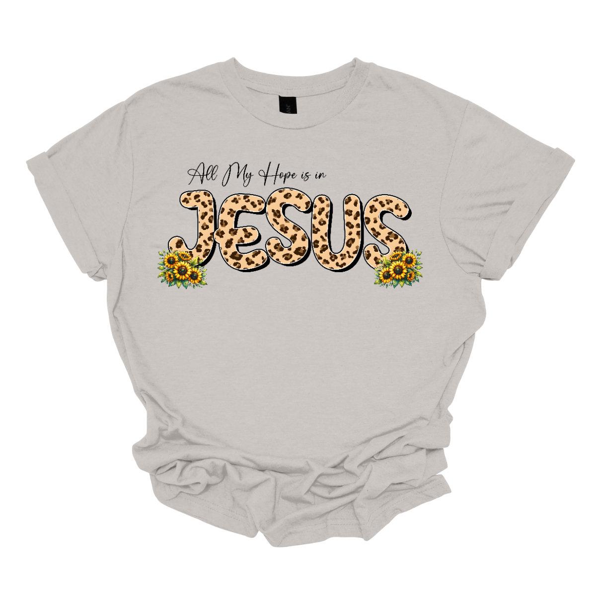 This shirt features the uplifting phrase "All My Hope is in Jesus" in a beautiful design. The text is written in elegant black script, with the word "Jesus" standing out in bold, bubble script, filled with a trendy animal print pattern in the middle. Surrounding the lettering are delicate, colorful flowers that frame the message, adding a touch of nature's beauty to the design. Shop Gorgeousware.com