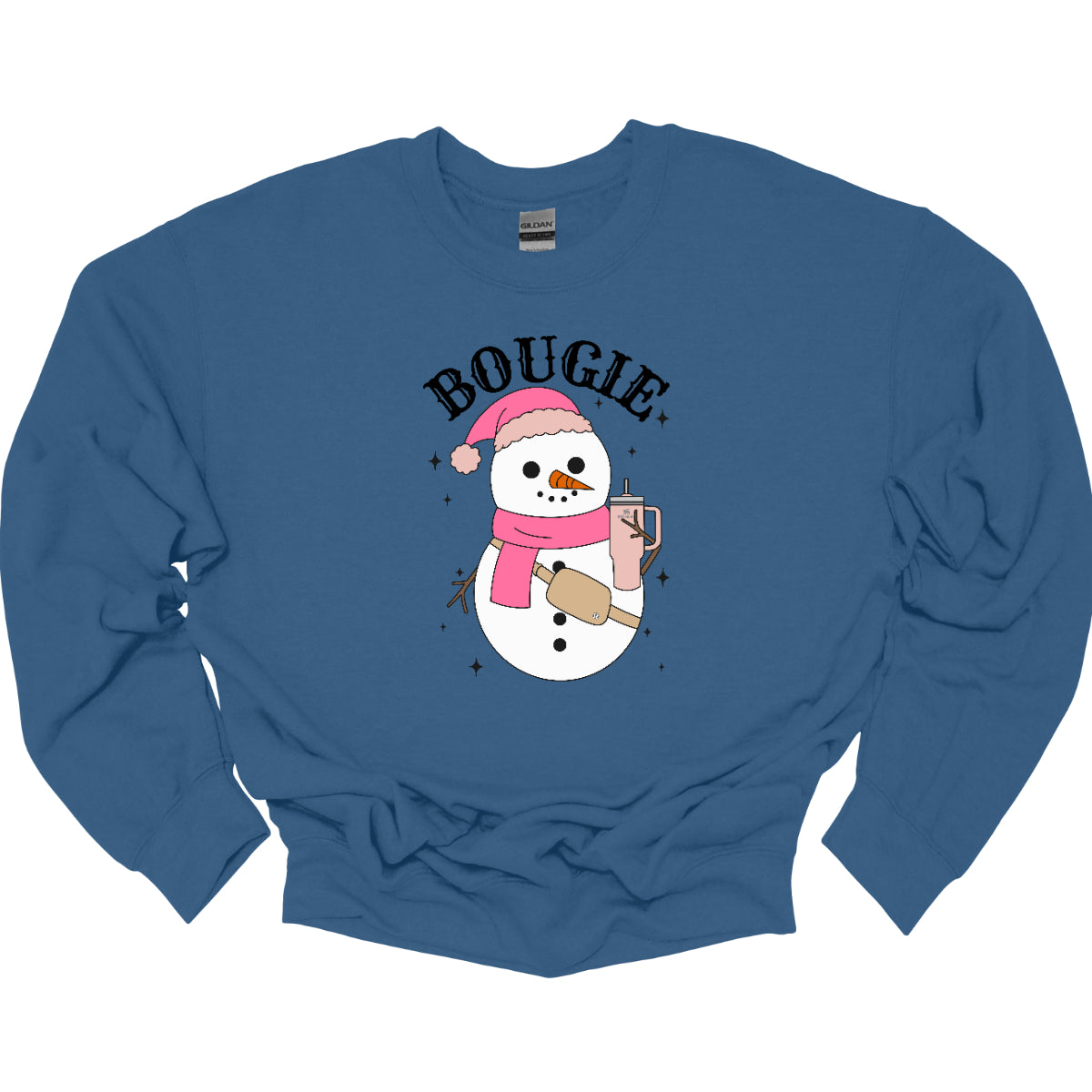 This chic t-shirt features the word "BOUGIE" in elegant, fancy lettering, capturing a stylish vibe. Beneath the text is a charming illustration of a snowman, decked out in a cute pink hat and scarf, exuding festive flair. The snowman is holding a pale pink Stanley cup, adding a trendy touch, while a beige Lululemon belt bag rests around its waist, complete with sparkles that catch the eye and enhance the glamorous theme. Shop Gorgeousware.com