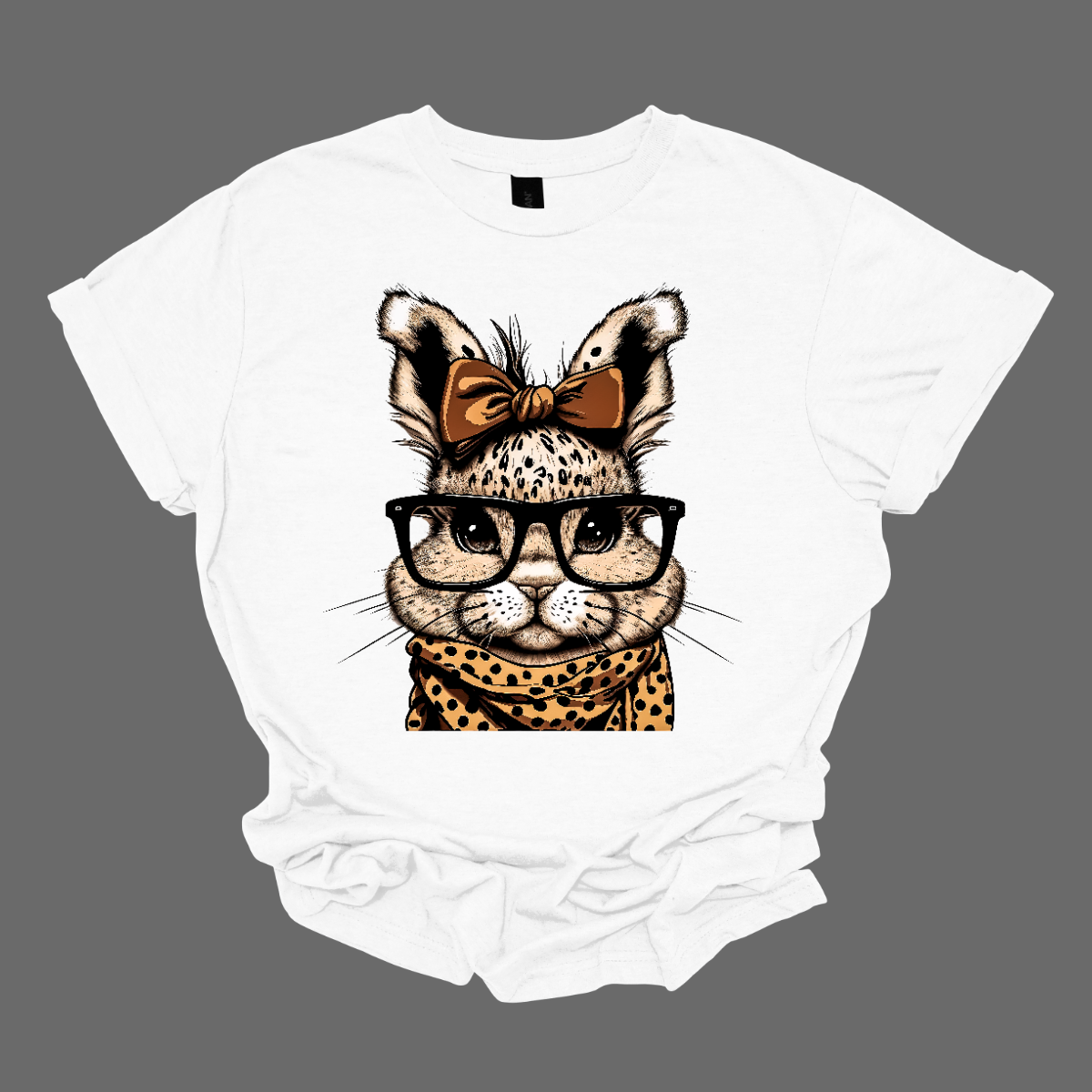 Unleash your wild side this Easter with our charming bunny T-shirt adorned with a cheetah print scarf! This delightful shirt combines the cuteness of a bunny with the fierce elegance of a cheetah, creating a unique and eye-catching design. Shop now at Gorgeousware.com