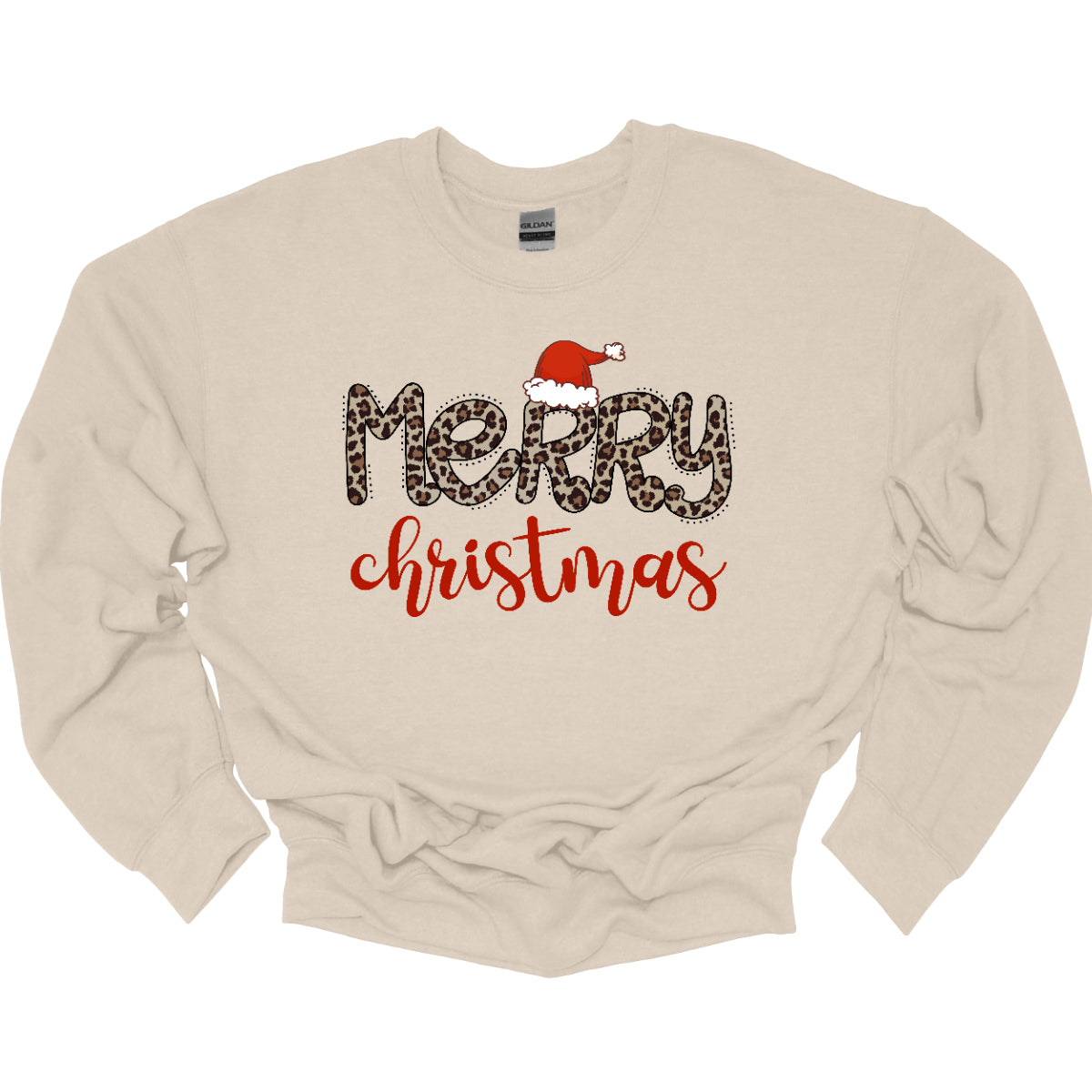 This festive t-shirt features the cheerful phrase "Merry Christmas." The word "Merry" is designed in a playful, bubbly font adorned with a fun cheetah print pattern, making it both eye-catching and stylish. The first "R" is topped with a whimsical Santa hat, adding a delightful holiday touch. Below, the word "Christmas" flows in a beautiful red cursive font, enhancing the festive spirit. This shirt is perfect for spreading holiday cheer with a fun and trendy twist! Shop Gorgeousware.com