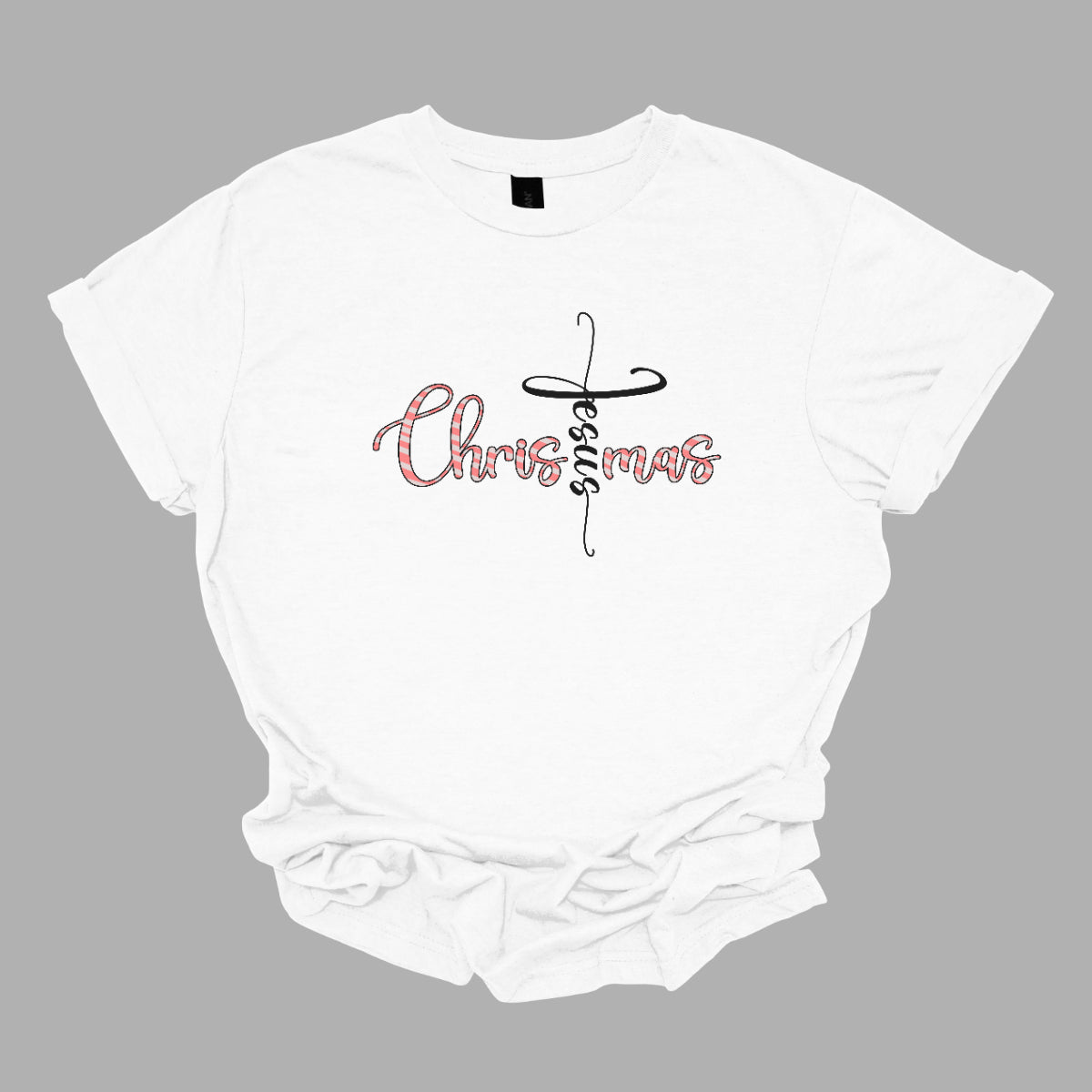 This charming t-shirt features the word "Christmas" in a delightful bubbly cursive font, designed with festive white and red stripes to mimic a candy cane. A unique twist makes the letter "t" stand out as the word "Jesus" rendered in elegant black cursive font. This creative design beautifully blends holiday spirit with a meaningful message, making it a perfect choice for celebrating the season in style and faith! Shop Gorgeousware.com