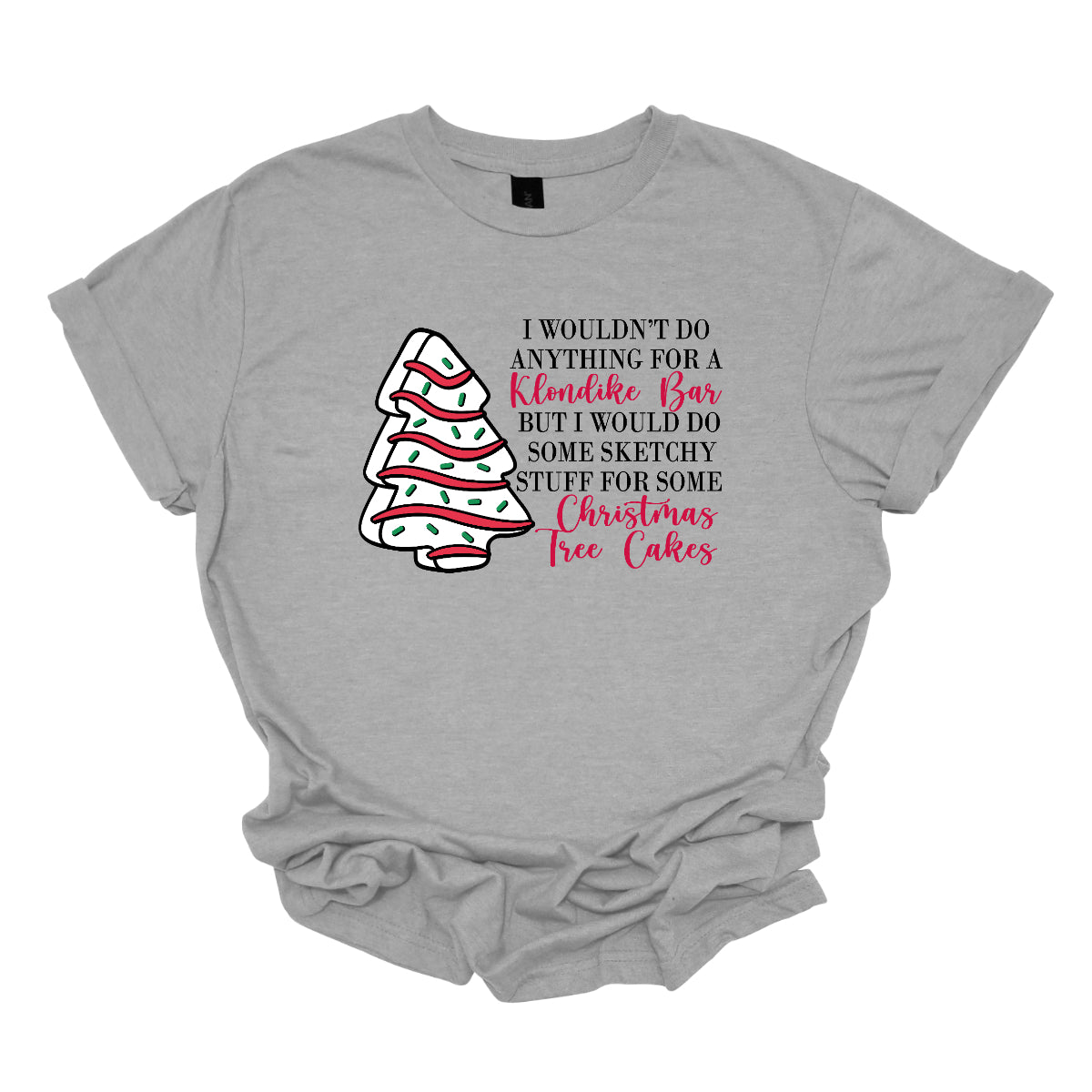 This fun t-shirt features a playful phrase: "I wouldn't do anything for a Klondike Bar but I would do some sketchy stuff for some Christmas Tree Cakes." The main text is presented in a sleek, professional black font, offering a clean contrast to the whimsical red cursive font used for "Klondike Bar" and "Christmas Tree Cakes," drawing attention to those key phrases. Shop Gorgeousware.com