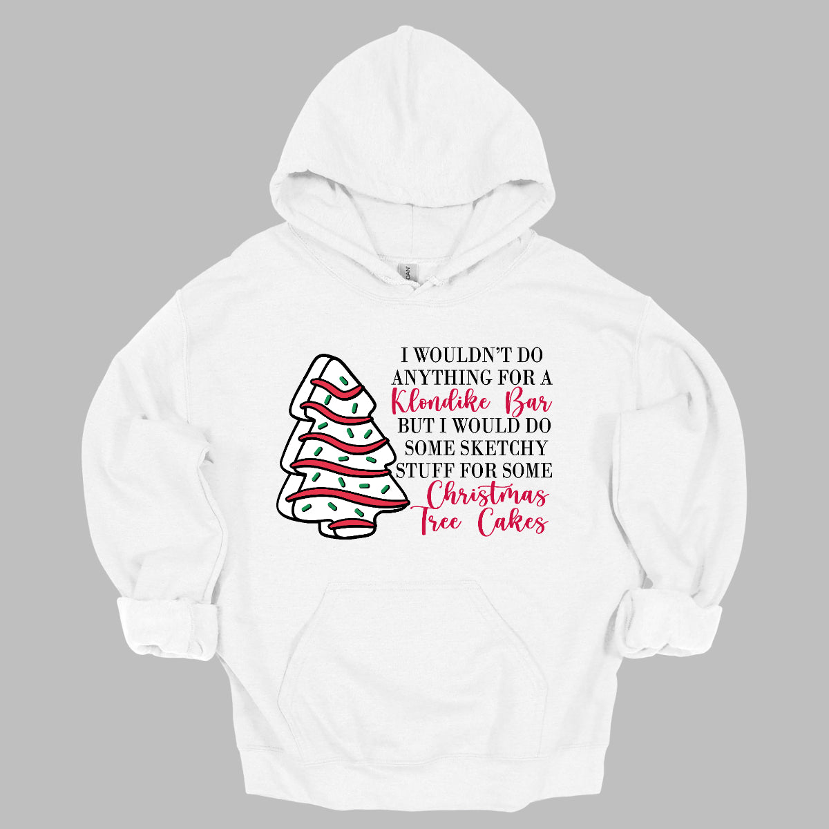 This fun t-shirt features a playful phrase: "I wouldn't do anything for a Klondike Bar but I would do some sketchy stuff for some Christmas Tree Cakes." The main text is presented in a sleek, professional black font, offering a clean contrast to the whimsical red cursive font used for "Klondike Bar" and "Christmas Tree Cakes," drawing attention to those key phrases. Shop Gorgeousware.com
