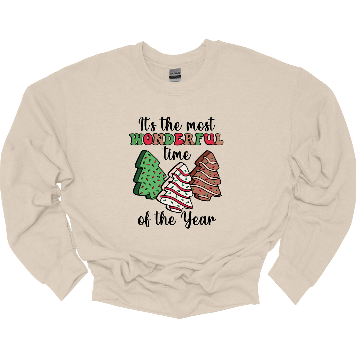 This festive t-shirt features the phrase "It's the most wonderful time of the year" in a stylish black cursive font, creating an elegant backdrop for the holiday message. The word "wonderful" stands out in a playful bubbly font that alternates between vibrant green, cheerful red, and warm brown, adding a whimsical touch. Shop Gorgeousware.com