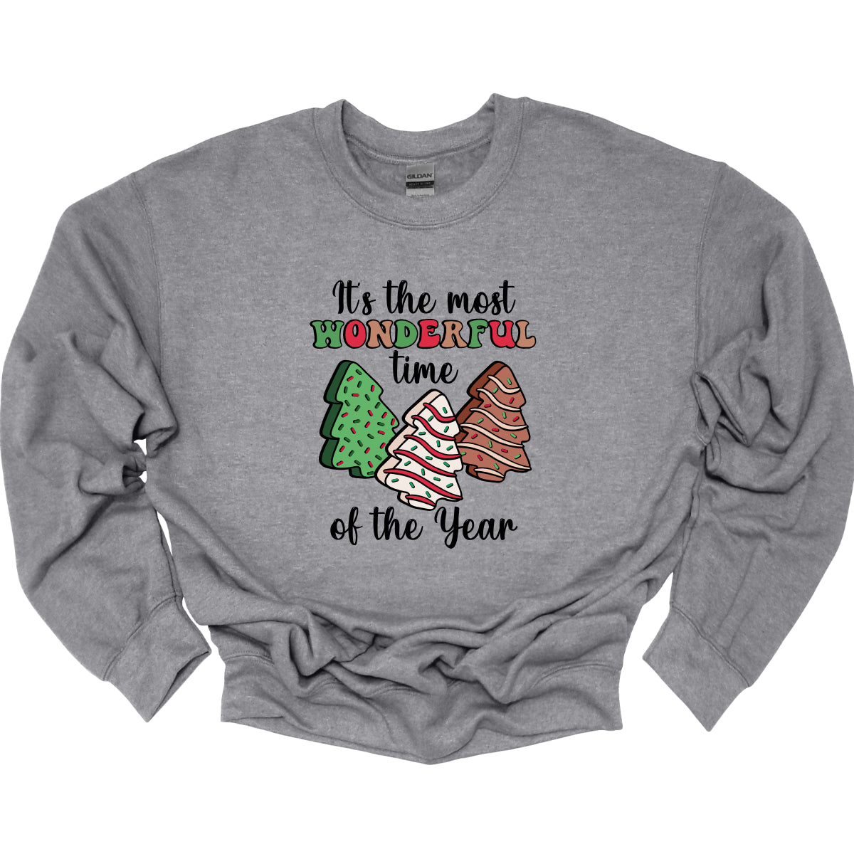 This festive t-shirt features the phrase "It's the most wonderful time of the year" in a stylish black cursive font, creating an elegant backdrop for the holiday message. The word "wonderful" stands out in a playful bubbly font that alternates between vibrant green, cheerful red, and warm brown, adding a whimsical touch. Shop Gorgeousware.com