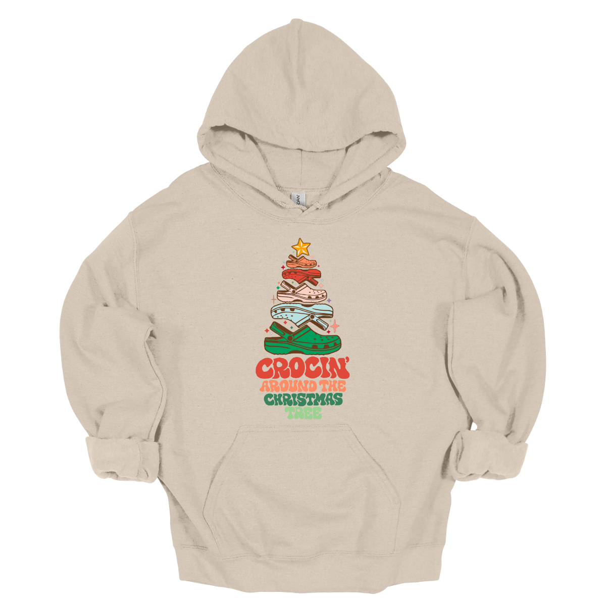This fun t-shirt features the playful phrase "Crockin' Around the Christmas Tree" in a retro-inspired font that combines vibrant reds and greens for a festive touch. The centerpiece of the design is a whimsical Christmas tree crafted entirely from colorful croc shoes, stacked creatively to form the classic shape. Topping off the tree is a shiny star, adding a delightful finishing touch. Shop at Gorgeousware.com