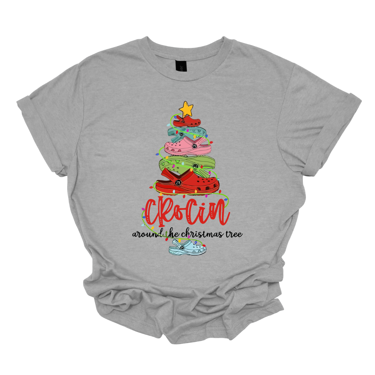 This playful t-shirt features the whimsical phrase "Crockin' Around the Christmas Tree," making it a perfect choice for those who love a fun holiday twist. The design centers around a unique Christmas tree made entirely of colorful croc shoes, stacked creatively to form the iconic shape. Shop at Gorgeousware.com