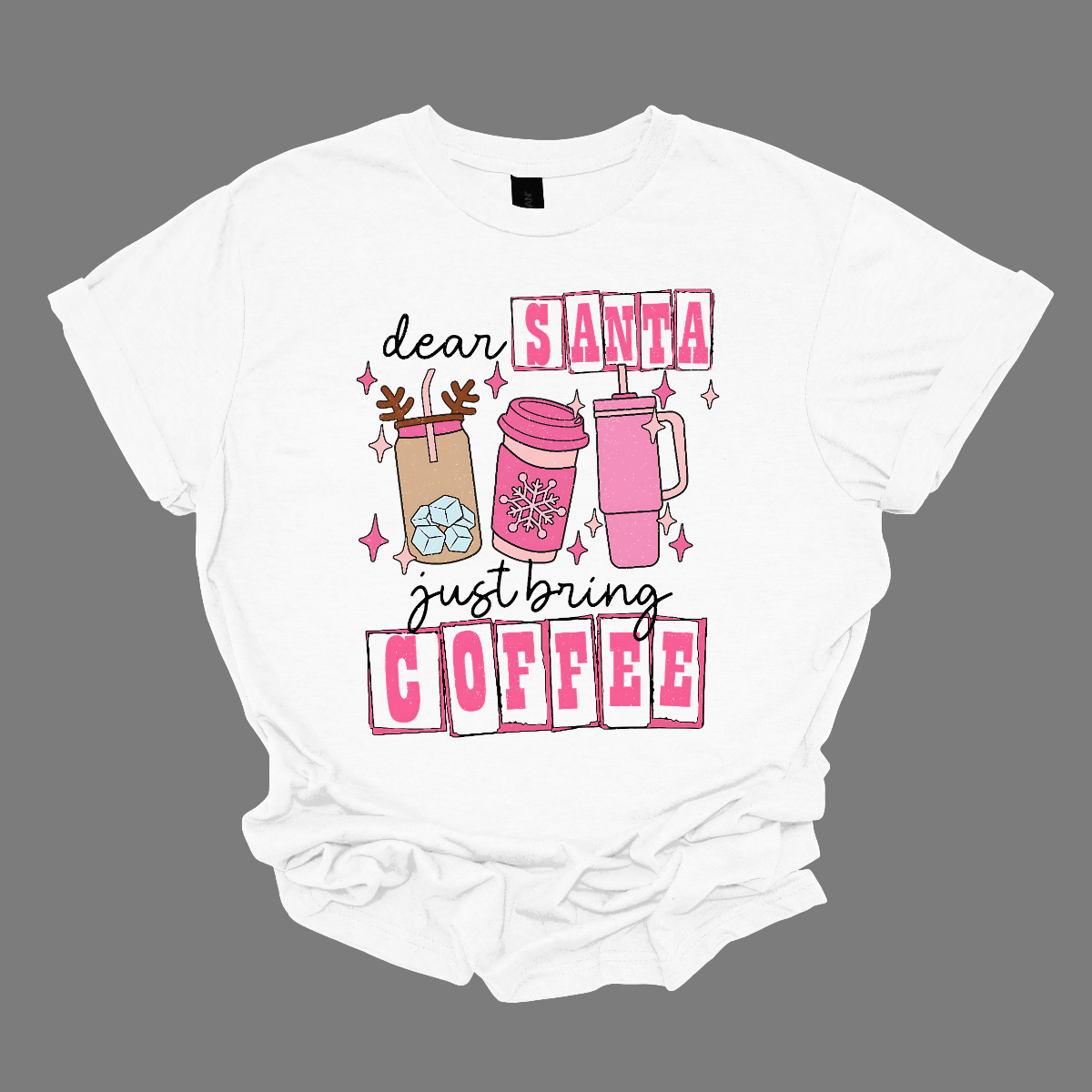 holiday season isn't complete without a little caffeine boost! The design features the cheeky phrase, "Dear Santa, Just bring coffee", in bold, fun lettering. The words "Santa" and "coffee" are highlighted with hot pink block-outlined boxes, adding a pop of color and flair to the design. Shop at Gorgeousware.com