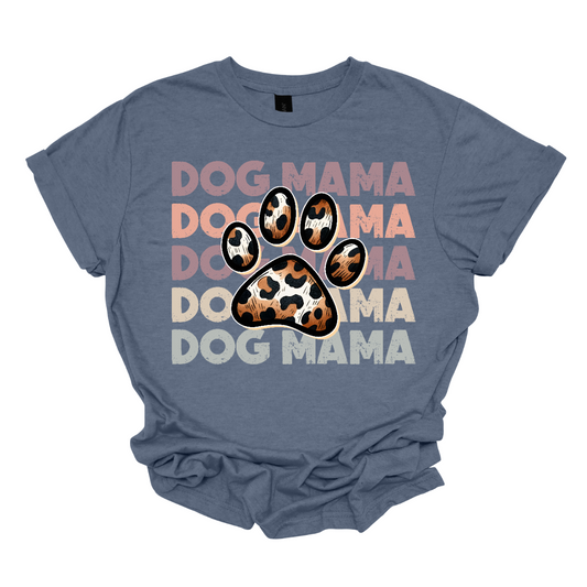 This shirt features a playful and stylish design that reads "Dog Momma" in bold, eye-catching text. In the center of the wording, a cute paw print is placed, adding a fun touch to the design. The paw pads inside the print are filled with a bold, animal print pattern, giving the design a trendy, wild vibe.   Shop Gorgeousware.com