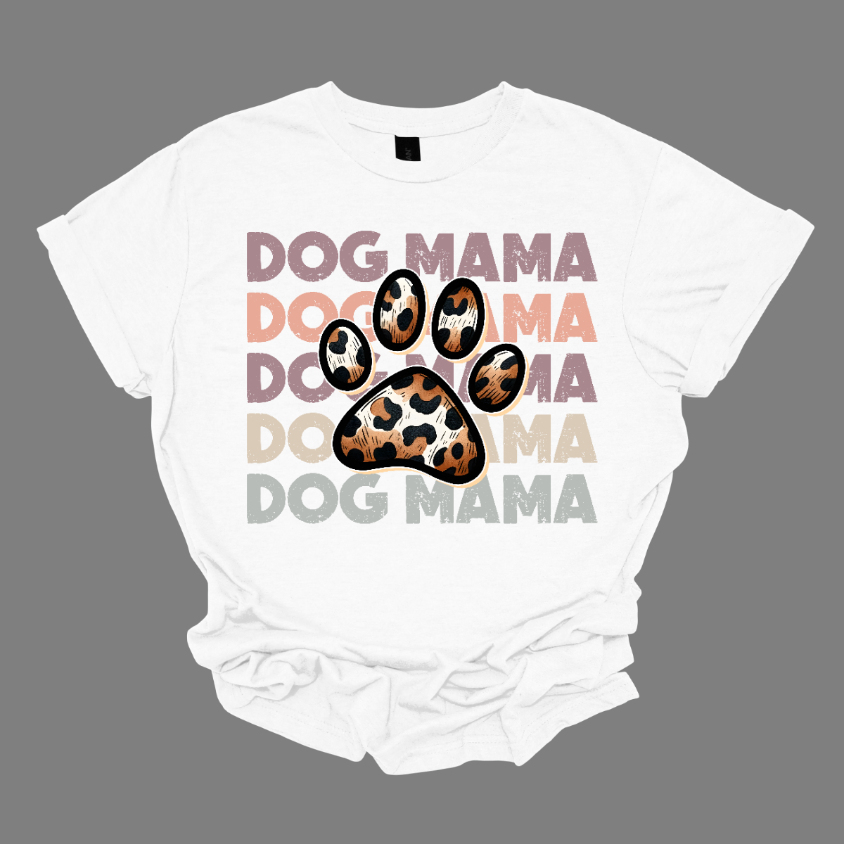 This shirt features a playful and stylish design that reads "Dog Momma" in bold, eye-catching text. In the center of the wording, a cute paw print is placed, adding a fun touch to the design. The paw pads inside the print are filled with a bold, animal print pattern, giving the design a trendy, wild vibe.   Shop Gorgeousware.com