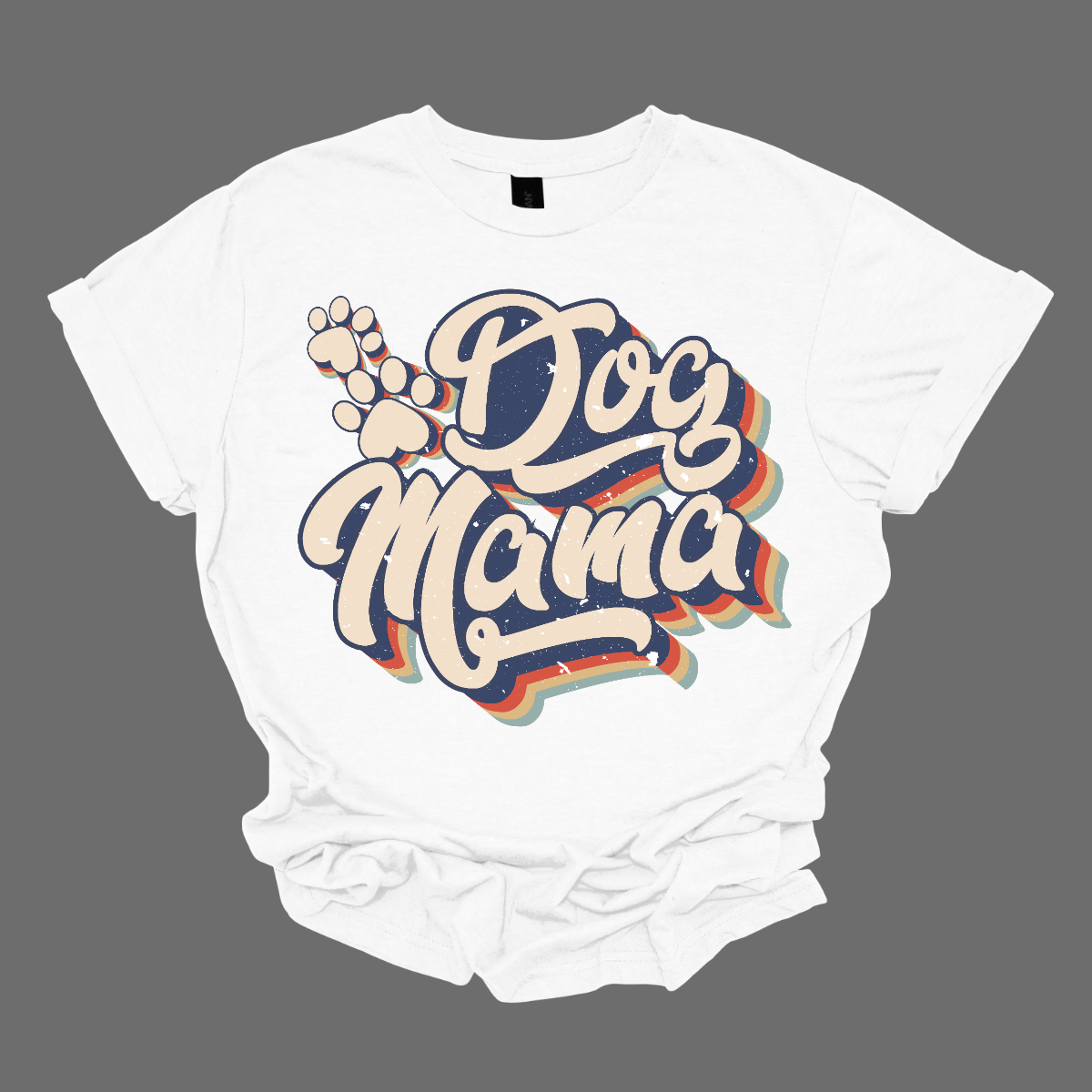 This shirt features the playful and stylish saying "Retro Dog Mama" in large, bold letters, designed to catch the eye with a vintage-inspired font. The letters are printed in a fun, retro style, evoking a sense of nostalgia. Alongside the text, there are cute paw prints scattered throughout the design, adding a touch of whimsy and highlighting the dog lover theme. Shop Gorgeousware.com