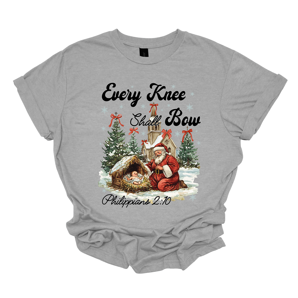 This festive and powerful apparel design features the phrase "Every Knee Shall Bow" in bold, elegant lettering, symbolizing the reverence and humility of the Christmas story. The artwork showcases Santa Claus, traditionally known for his joyful spirit, bowing down in awe before a humble manger that cradles baby Jesus. In the background, an old chapel stands as a symbol of faith, with evergreen trees adorned with festive bows, adding a touch of seasonal beauty and serenity. Shop at Gorgeousware.com