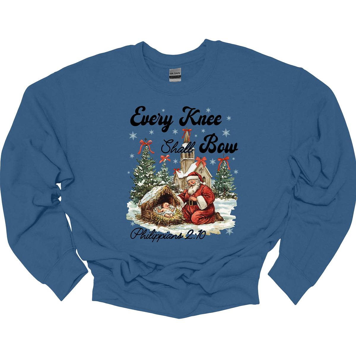 This festive and powerful apparel design features the phrase "Every Knee Shall Bow" in bold, elegant lettering, symbolizing the reverence and humility of the Christmas story. The artwork showcases Santa Claus, traditionally known for his joyful spirit, bowing down in awe before a humble manger that cradles baby Jesus. In the background, an old chapel stands as a symbol of faith, with evergreen trees adorned with festive bows, adding a touch of seasonal beauty and serenity. Shop at Gorgeousware.com