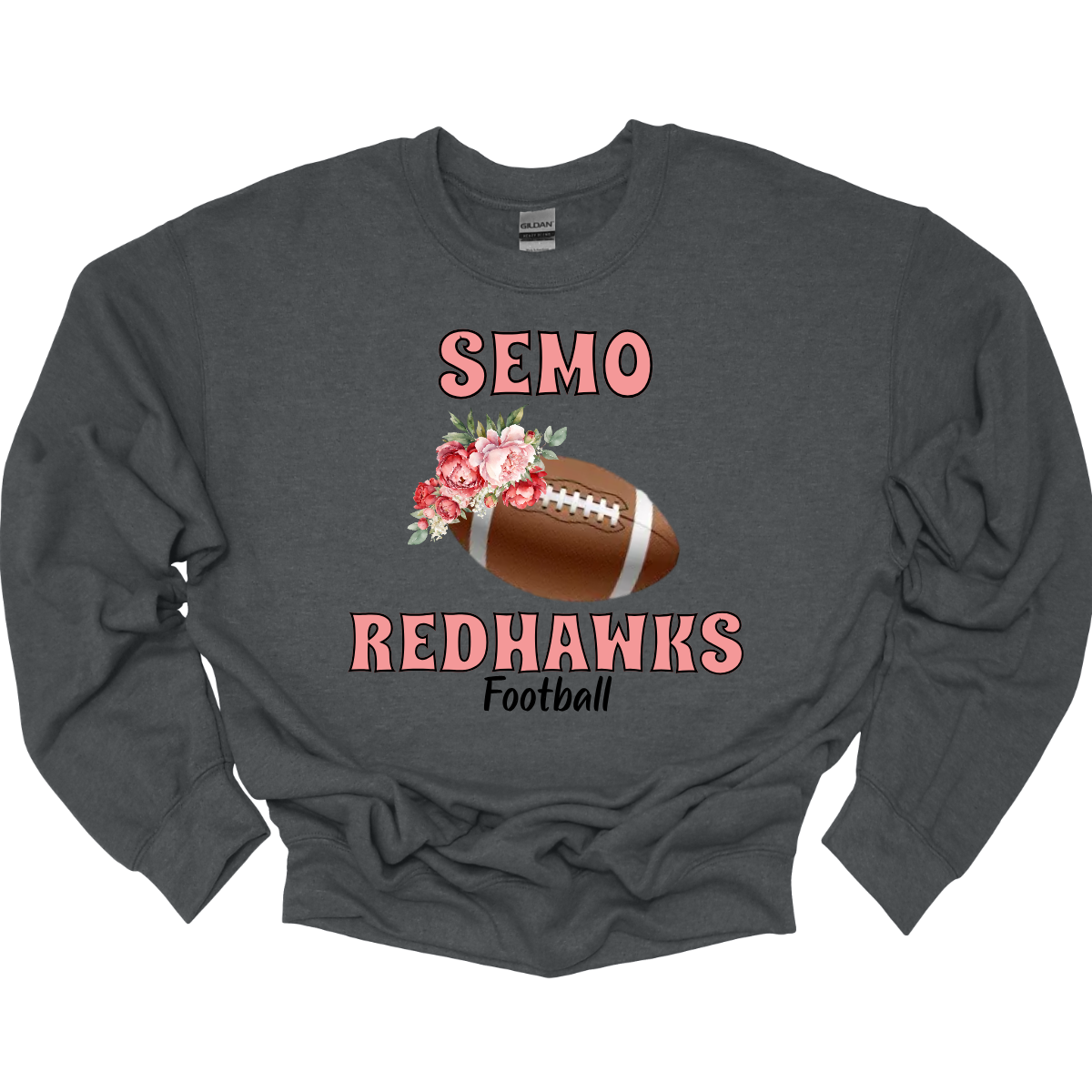 This SEMO crewneck features bold pink SEMO Redhawks lettering across the front, making your pride stand out in eye-catching fashion. A detailed football is accented with delicate flowers adds a unique, feminine twist, while the finishing touch of bold black Football lettering ties the look together. This design blends fierce Redhawk energy with a soft, stylish edge.
Shop at Gorgeousware.com today!