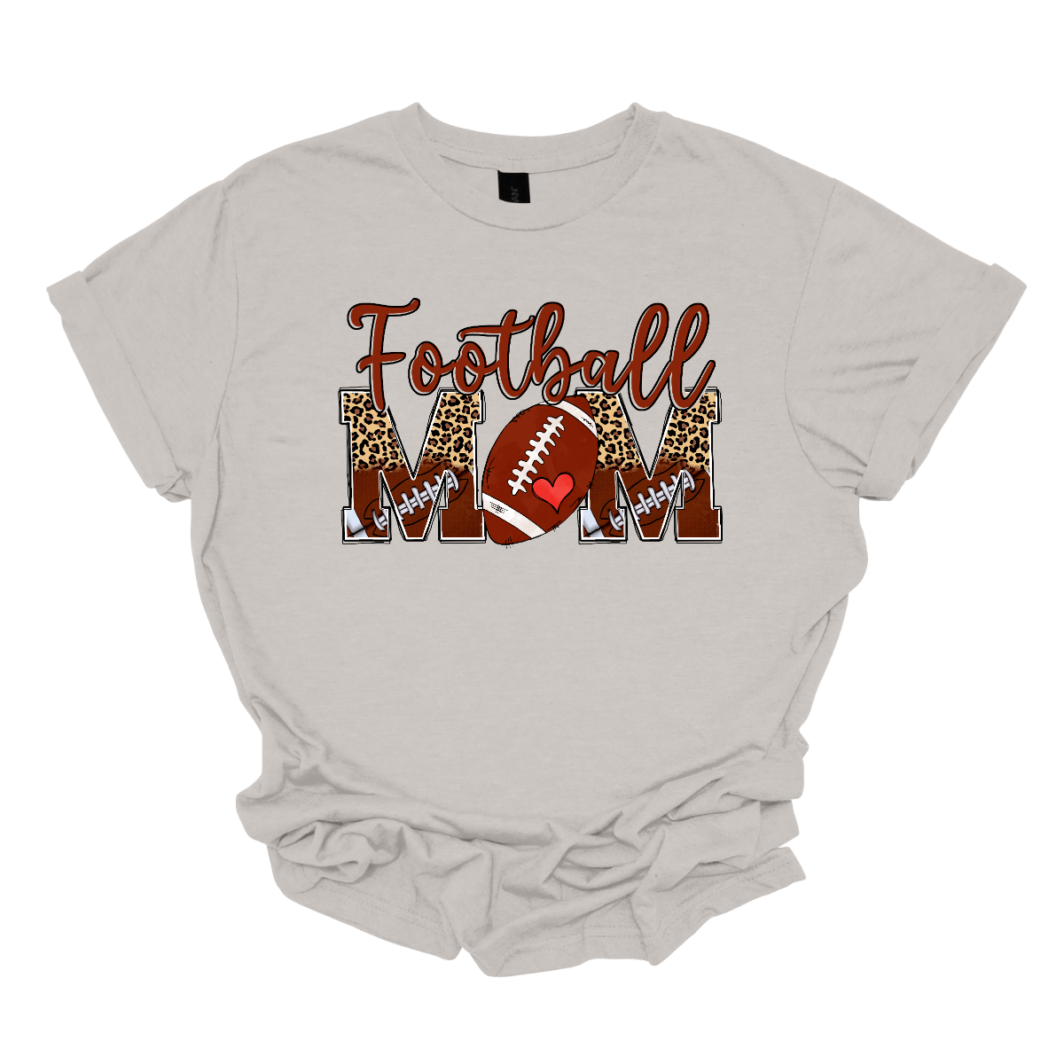 This "Football Mom" shirt design features a stylish and bold look perfect for any proud football mom.
"Football" is written in a fun, flowing brown script. "MOM" is displayed in large split block letters, The top half of the letters showcases a trendy cheetah print, adding a touch of fierce and fashionable flair.
The bottom half is decorated with a pattern of small footballs. The "O" in "MOM" is creatively replaced with a football. Shop Gorgeousware.com