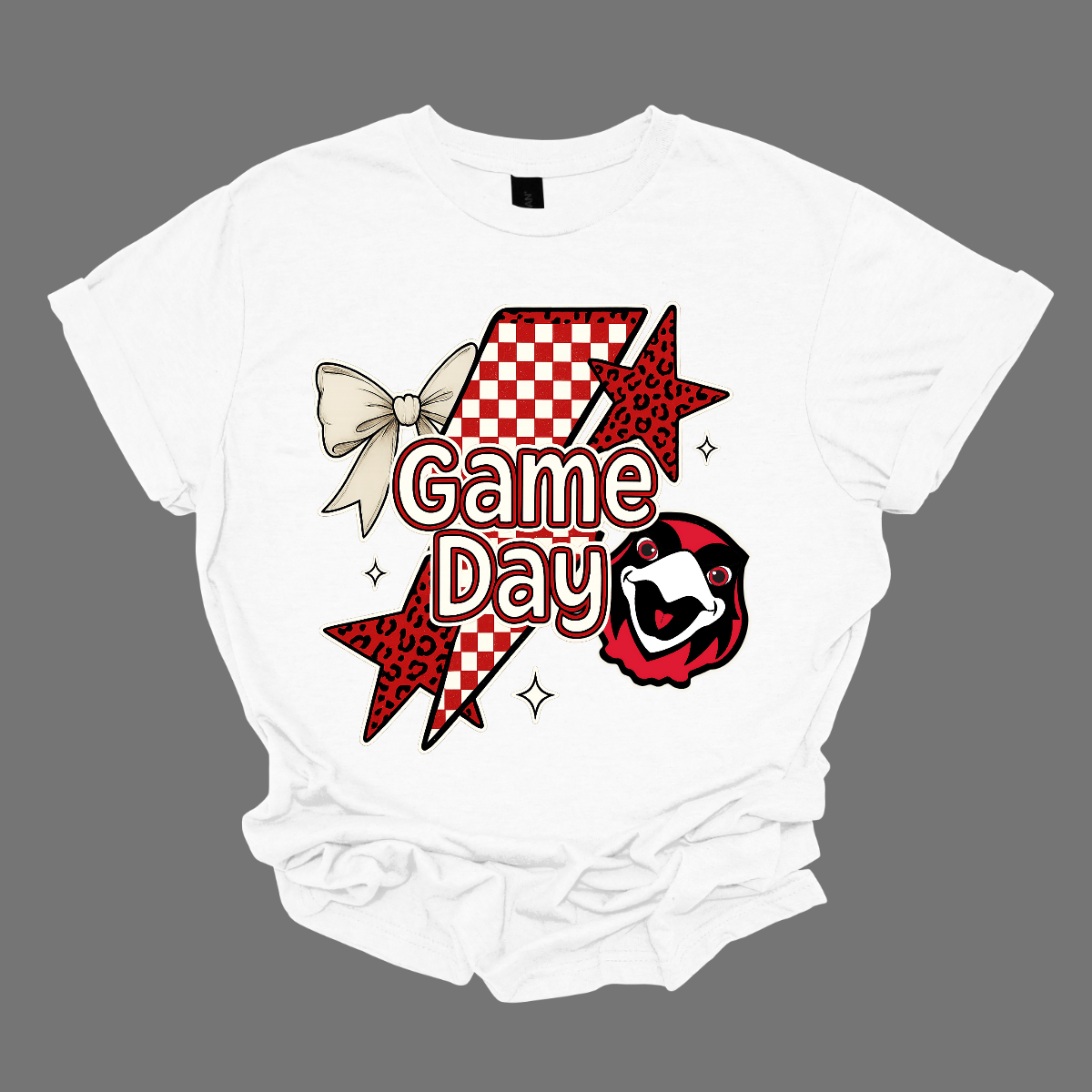 Bring the energy of the stands to your style with the Game Day Rowdy SEMO short and long sleeve shirt! This eye-catching piece features striking shooting stars that celebrates SEMO’s unstoppable momentum. At the heart of the design, the fearless Redhawk, symbolizing strength and school pride. A playful croquette bow adds a unique touch of flair, while the powerful “Game Day” lettering in crisp white overlays the design—reminding everyone you’re ready to cheer loud and proud.
Shop at Gorgeouswear.com today!