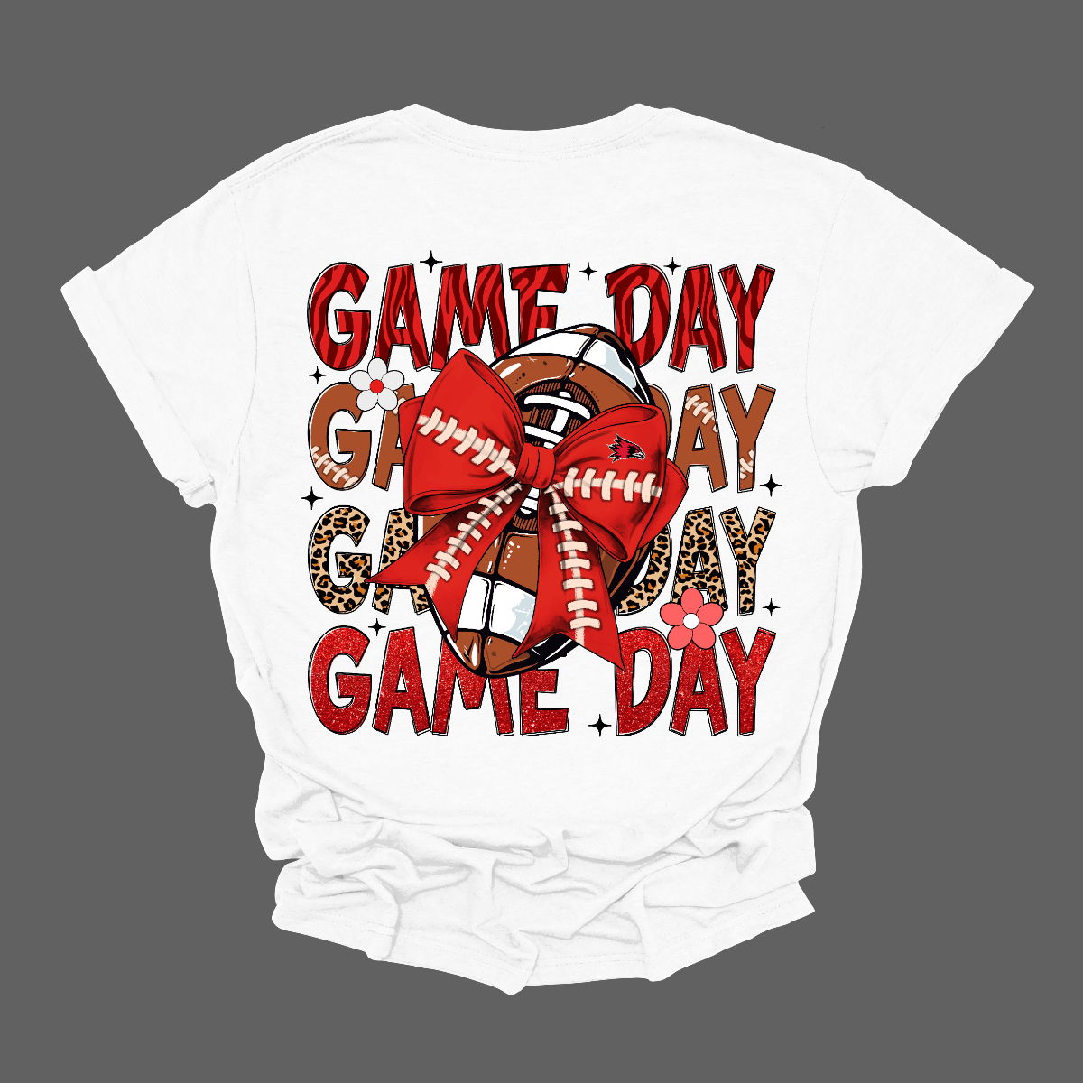 This bold SEMO short-sleeved tee packs serious team spirit into every detail. The front has a ferocious Redhawk graphic paired with SEMO in bold white lettering over the left chest. The back has “Game Day” repeated in eye catching animal print and football-lace lettering. A football wrapped in a red bow steals the spotlight, complete with football-lace details and a small Redhawk perched on the bow. Shop at Gorgeousware.com today!