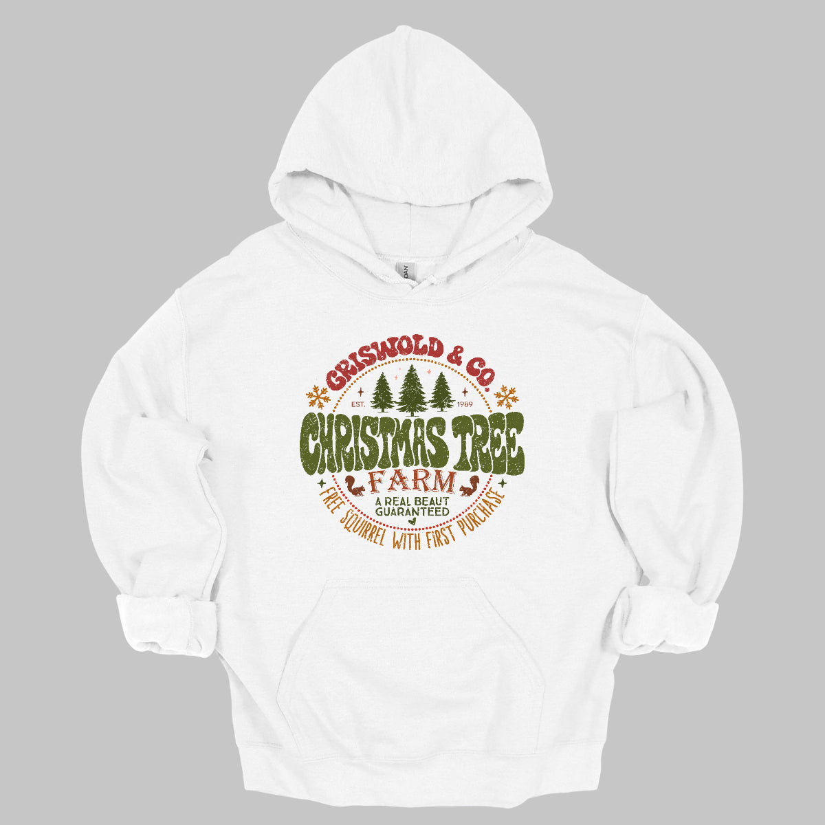This festive t-shirt captures the spirit of holiday fun with a design inspired by classic Christmas cheer. The shirt features the words “Christmas Tree Farm” prominently displayed, with “Christmas Tree” in vibrant green bubble letters that pop with playful energy.Encircling this central text is “Griswold & CO.,” giving it a nostalgic nod to the iconic family from holiday movie lore. Surrounding the main text are memorable quotes from the movie. Shop Gorgeousware.com