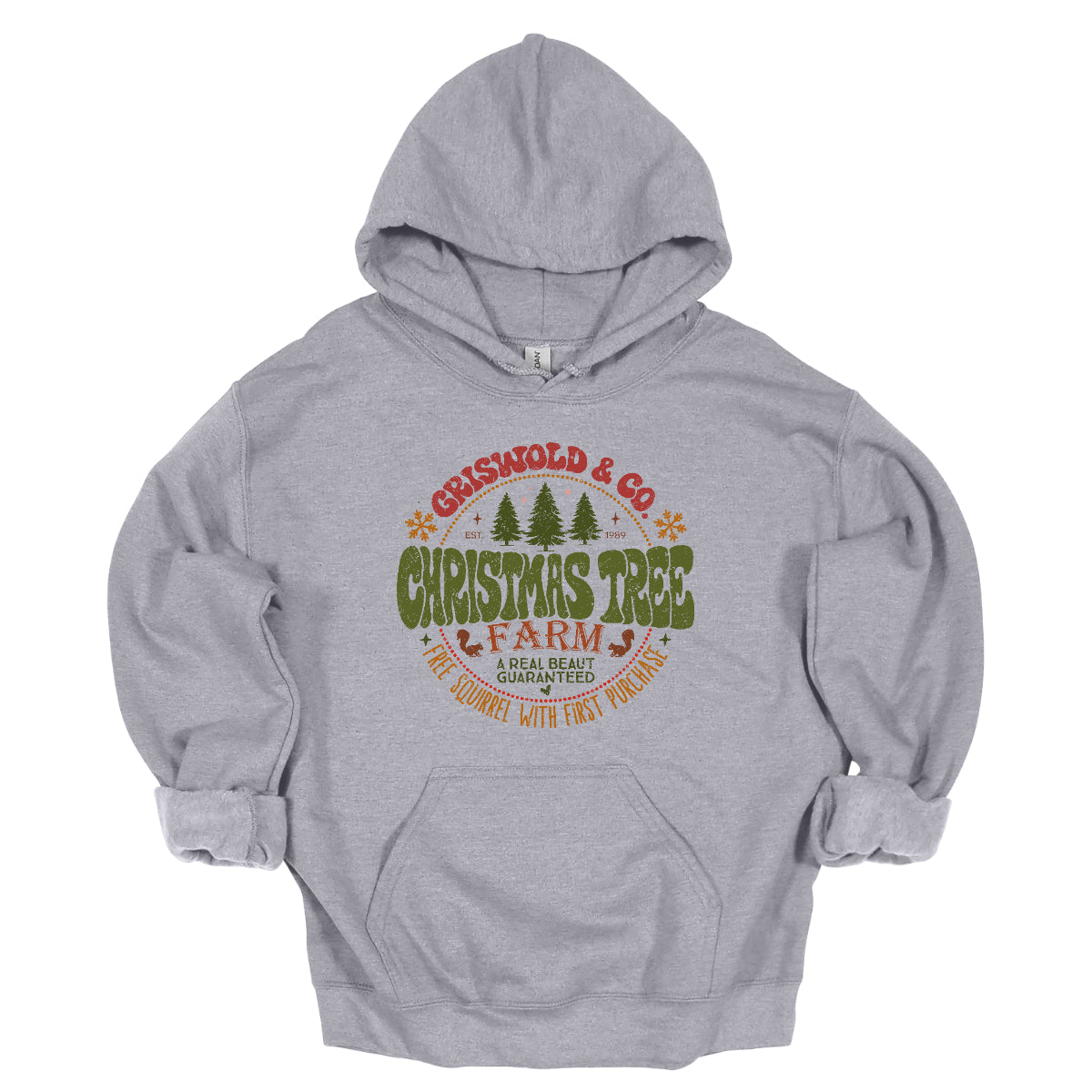 This festive t-shirt captures the spirit of holiday fun with a design inspired by classic Christmas cheer. The shirt features the words “Christmas Tree Farm” prominently displayed, with “Christmas Tree” in vibrant green bubble letters that pop with playful energy.Encircling this central text is “Griswold & CO.,” giving it a nostalgic nod to the iconic family from holiday movie lore. Surrounding the main text are memorable quotes from the movie. Shop Gorgeousware.com
