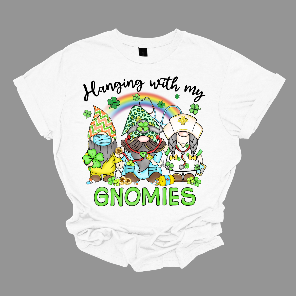 ☘️ "Hanging with my Gnomies" St. Patrick's Day T-shirt: A Tribute to Healthcare Heroes! ☘️ Get into the St. Patrick's Day spirit with our heartwarming and whimsical tee featuring three charming gnomes dressed in healthcare worker apparel, complete with stethoscopes. It's a delightful fusion of Irish cheer and appreciation for the incredible work of our healthcare heroes. Shop at Gorgeousware.com today!