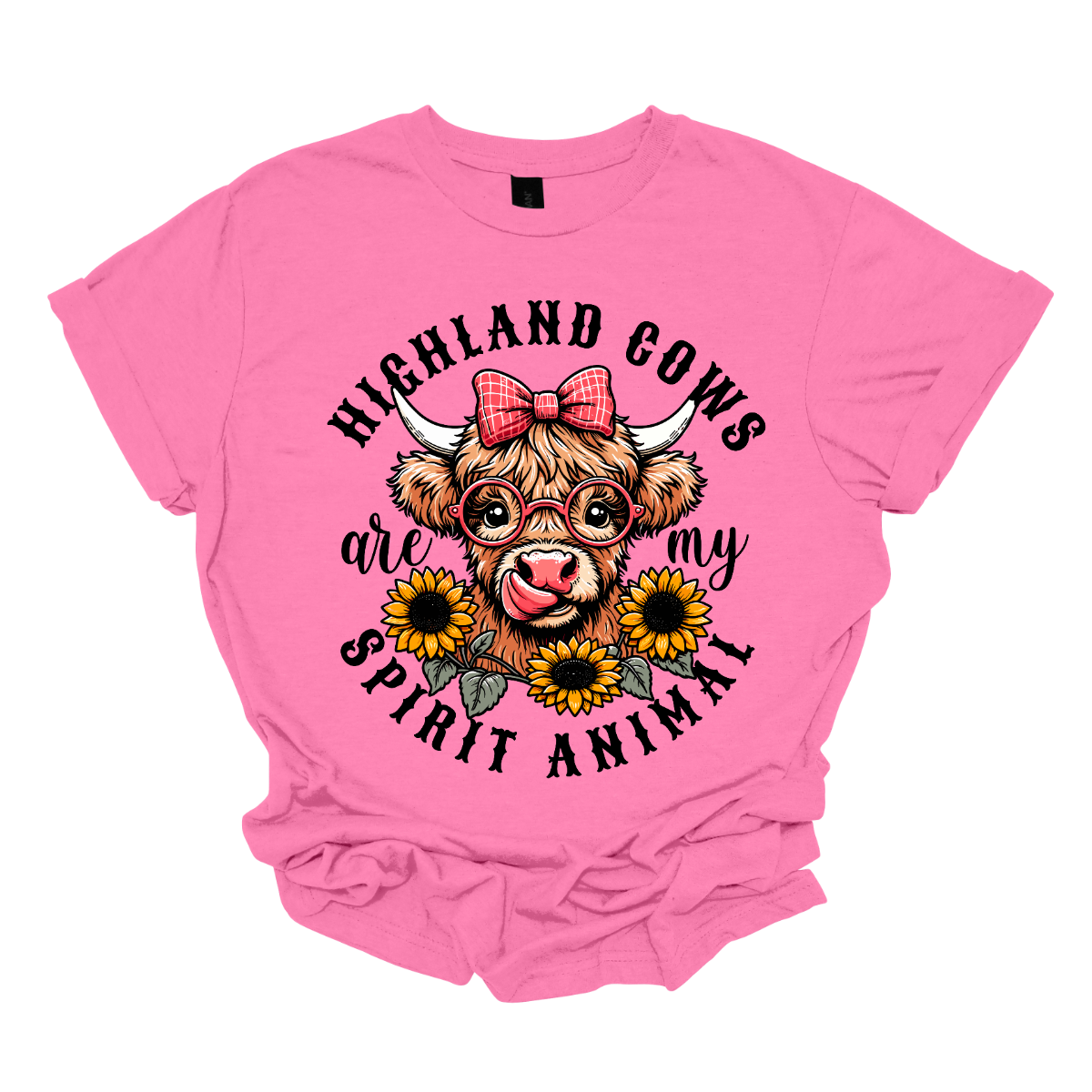 This shirt showcases a delightful Highland cow, complete with a cute bow on its head and stylish glasses, radiating charm and personality. Beneath the cow, a lovely arrangement of yellow daisies creates a soft, floral touch, adding a pop of color and whimsy to the design. The phrase "Highland Cows are my spirit animal" is playfully displayed, capturing the cow's spirit and the wearer's connection to these unique creatures. Shop Gorgeouseware.com
