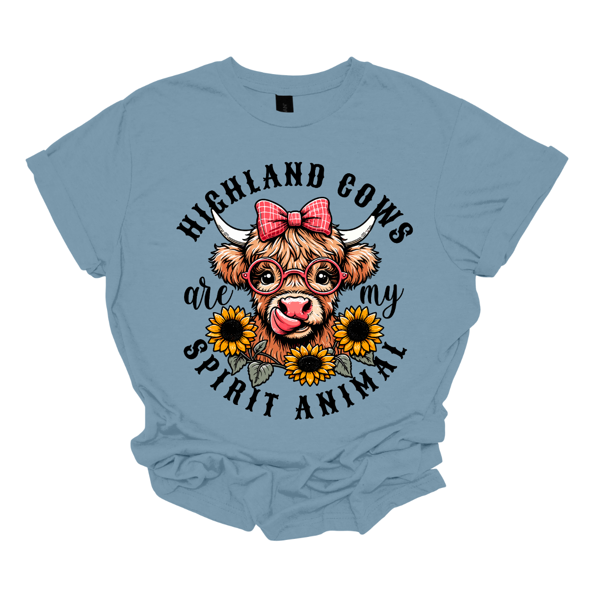 This shirt showcases a delightful Highland cow, complete with a cute bow on its head and stylish glasses, radiating charm and personality. Beneath the cow, a lovely arrangement of yellow daisies creates a soft, floral touch, adding a pop of color and whimsy to the design. The phrase "Highland Cows are my spirit animal" is playfully displayed, capturing the cow's spirit and the wearer's connection to these unique creatures. Shop Gorgeouseware.com