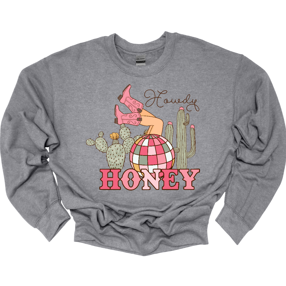 Introducing our "Howdy Honey" T-shirt – a dazzling and charming garment that brings together Western flair and a touch of disco glamour. This shirt features delightful elements such as cowgirl boots, cactuses, and a vibrant pink and white disco ball, creating a unique fusion of country and disco aesthetics. Adorning the T-shirt are stylish cowgirl boots, adding a Western charm, and cactuses that bring a hint of desert landscape. Shop at Gorgeousware.com