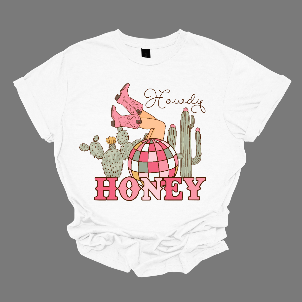 Introducing our "Howdy Honey" T-shirt – a dazzling and charming garment that brings together Western flair and a touch of disco glamour. This shirt features delightful elements such as cowgirl boots, cactuses, and a vibrant pink and white disco ball, creating a unique fusion of country and disco aesthetics. Adorning the T-shirt are stylish cowgirl boots, adding a Western charm, and cactuses that bring a hint of desert landscape. Shop at Gorgeousware.com