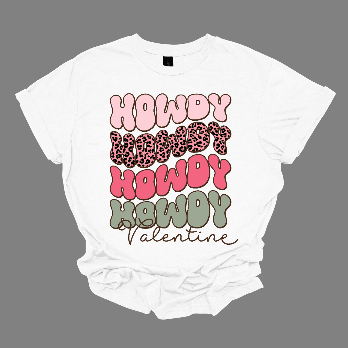Introducing our "Howdy Valentine" T-shirt – a retro-inspired masterpiece that adds a touch of vintage charm to your Valentine's Day celebration. This shirt features a stylish retro font in soft pinks and sage colors, creating a delightful and nostalgic vibe perfect for expressing love with a Western twist. The phrase "Howdy Valentine" is elegantly displayed in a retro font, evoking the classic aesthetics of bygone eras. Shop at Gorgeousware.com