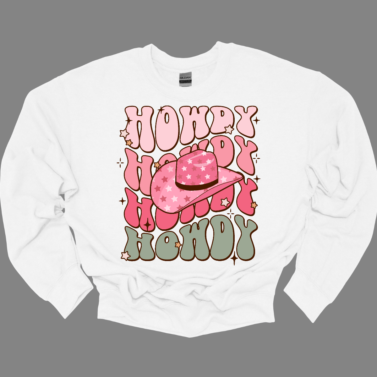 Introducing our "Howdy" T-shirt – a retro-inspired delight that captures the essence of Western charm with a stylish twist. The retro font adds a touch of nostalgia, evoking the classic aesthetics of yesteryears. The prominent cowgirl hat in the middle becomes a focal point, bringing a Western flair to the design. Shop at Gorgeousware.com