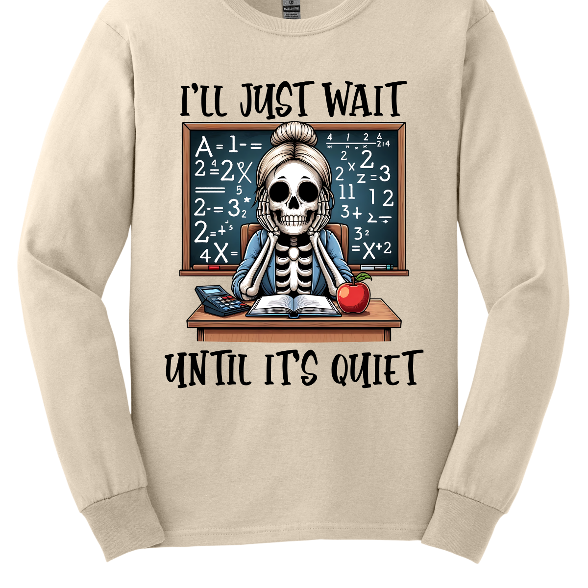 This T-shirt features a skeleton sitting at a cluttered desk, dressed in a cozy cardigan with a messy bun on top of its skull. The skeleton is leaning forward, resting its head on its bony hands as if exhausted or overwhelmed. The shirt says, "I'll just wait until its quiet". Shop at Gorgeousware.com