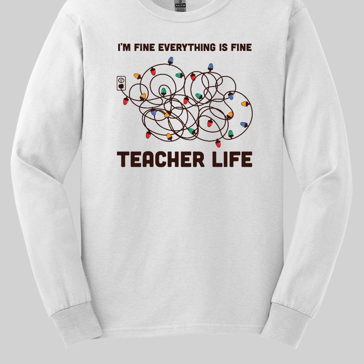 This humorous t-shirt features the phrase "I'm fine, everything is fine" in bold, playful lettering, perfectly capturing that relatable holiday vibe. Below the text, there's a whimsical illustration of a tangled wad of Christmas lights plugged into an outlet, humorously representing the chaos that can come with the season. Underneath the lights, the words "Teacher Life" are displayed, adding a clever nod to the unique challenges teachers face, especially during the festive rush. Shop at Gorgeousware.com