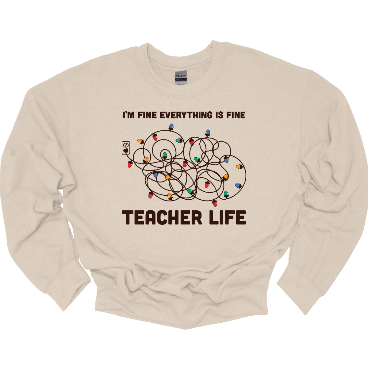 This humorous t-shirt features the phrase "I'm fine, everything is fine" in bold, playful lettering, perfectly capturing that relatable holiday vibe. Below the text, there's a whimsical illustration of a tangled wad of Christmas lights plugged into an outlet, humorously representing the chaos that can come with the season. Underneath the lights, the words "Teacher Life" are displayed, adding a clever nod to the unique challenges teachers face, especially during the festive rush. Shop at Gorgeousware.com