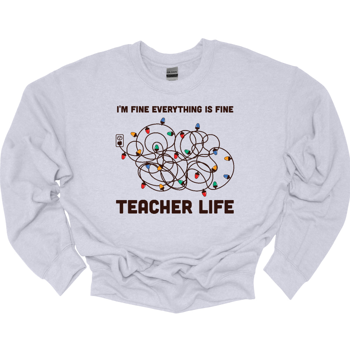 This humorous t-shirt features the phrase "I'm fine, everything is fine" in bold, playful lettering, perfectly capturing that relatable holiday vibe. Below the text, there's a whimsical illustration of a tangled wad of Christmas lights plugged into an outlet, humorously representing the chaos that can come with the season. Underneath the lights, the words "Teacher Life" are displayed, adding a clever nod to the unique challenges teachers face, especially during the festive rush. Shop at Gorgeousware.com