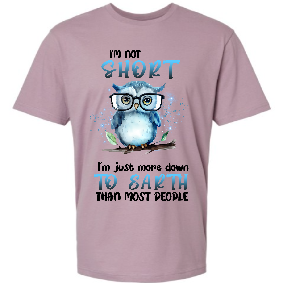 This fun and quirky shirt features the playful message, "I'm not short" at the top and "I'm just more down to earth than most people" at the bottom. The bold print font highlights the words "short" and "to earth" in vibrant blue lettering. The text is divided into two sections, with an adorable blue owl wearing oversized glasses perched on a branch in the center. It's the perfect shirt for those with a great sense of humor and a down-to-earth attitude. Shop now at Gorgeousware.com