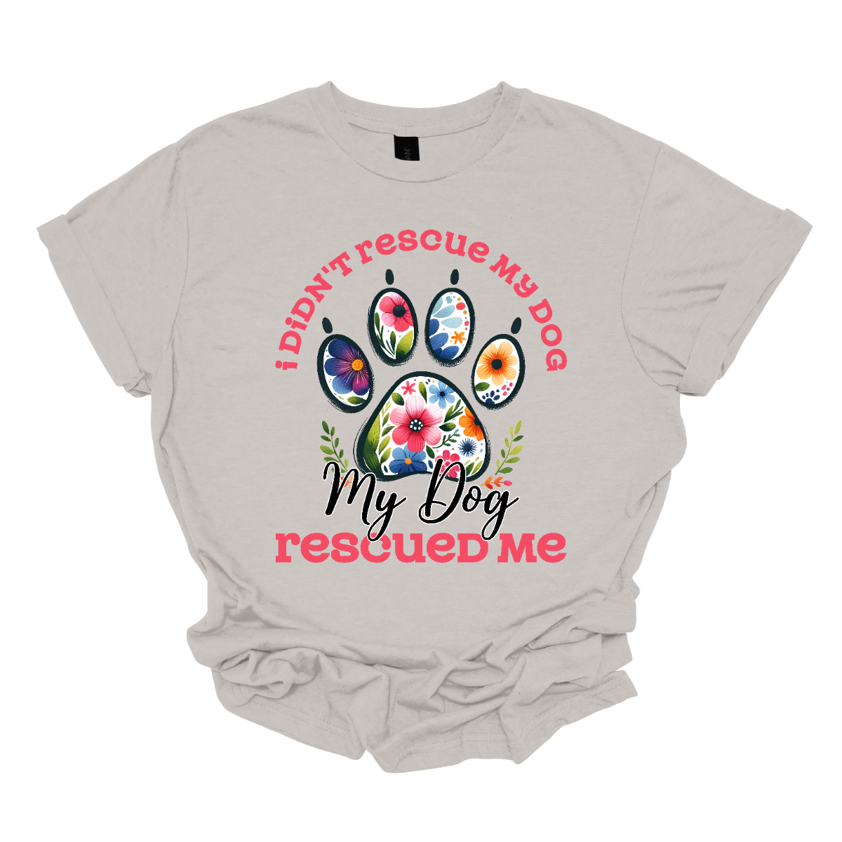 This shirt features a heartwarming and empowering message that says, "I didn't rescue my dog, my dog rescued me." The design centers around a large, bold paw print, with the pads of the paw beautifully adorned with intricate floral details. The combination of pink and black lettering gives the design a stylish and vibrant contrast. Shop Gorgeouseware.com