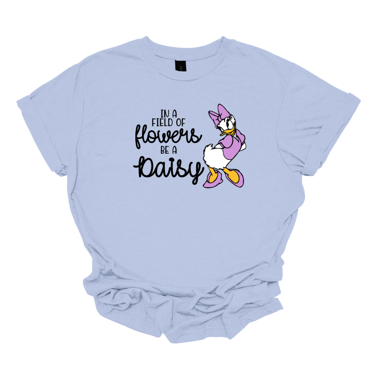 This t-shirt features an inspiring and charming design with the uplifting message: "In a Field of Flowers Be a Daisy." The phrase is styled with a delightful mix of fonts. The words "In a Field of" and "Be a" are written in a playful black font, bringing a touch of fun to the overall look. The words "Flowers" and "Daisy" are highlighted in a graceful black cursive font, adding a touch of elegance and flow. Next to the text, there’s a cute illustration of the cartoon character Daisy. Shop Gorgeousware.com
