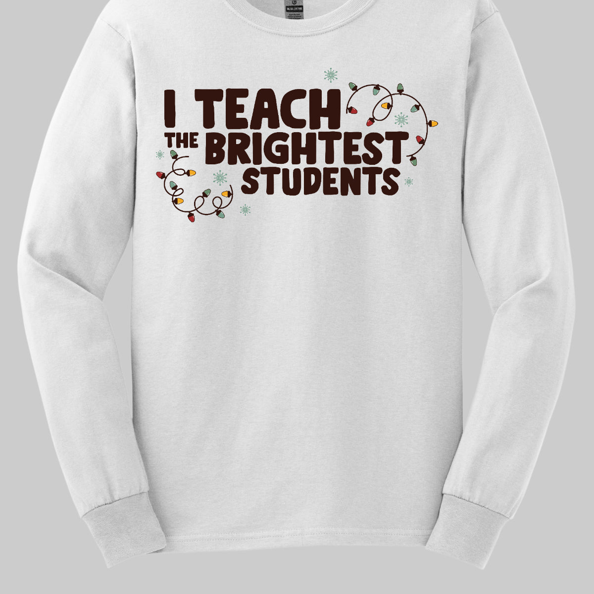 Celebrate your passion for teaching with our "I Teach the Brightest Students" t-shirt! This fun and festive design features cheerful Christmas lights framing the text, adding a touch of holiday spirit to your classroom vibe. Made from soft, comfortable fabric, it’s perfect for wearing during the festive season or any day you want to show off your pride in your students. Brighten up your wardrobe and spread some joy—because every great teacher deserves to