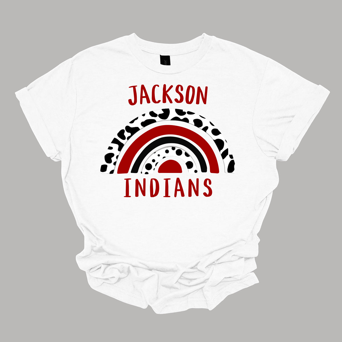 Show off your unique Indian spirit with our Jackson Indians apparel featuring a one-of-a-kind design! This eye-catching piece highlights a whimsical rainbow pattern, infused with a bold cheetah print for an adventurous twist. The playful rainbow arcs across the design, blending vibrant colors with the fierce, energetic vibe of the cheetah print. At the heart of it all, the Jackson Indians logo stands proudly, ensuring your school pride shines through. Shop at Gorgeousware.com