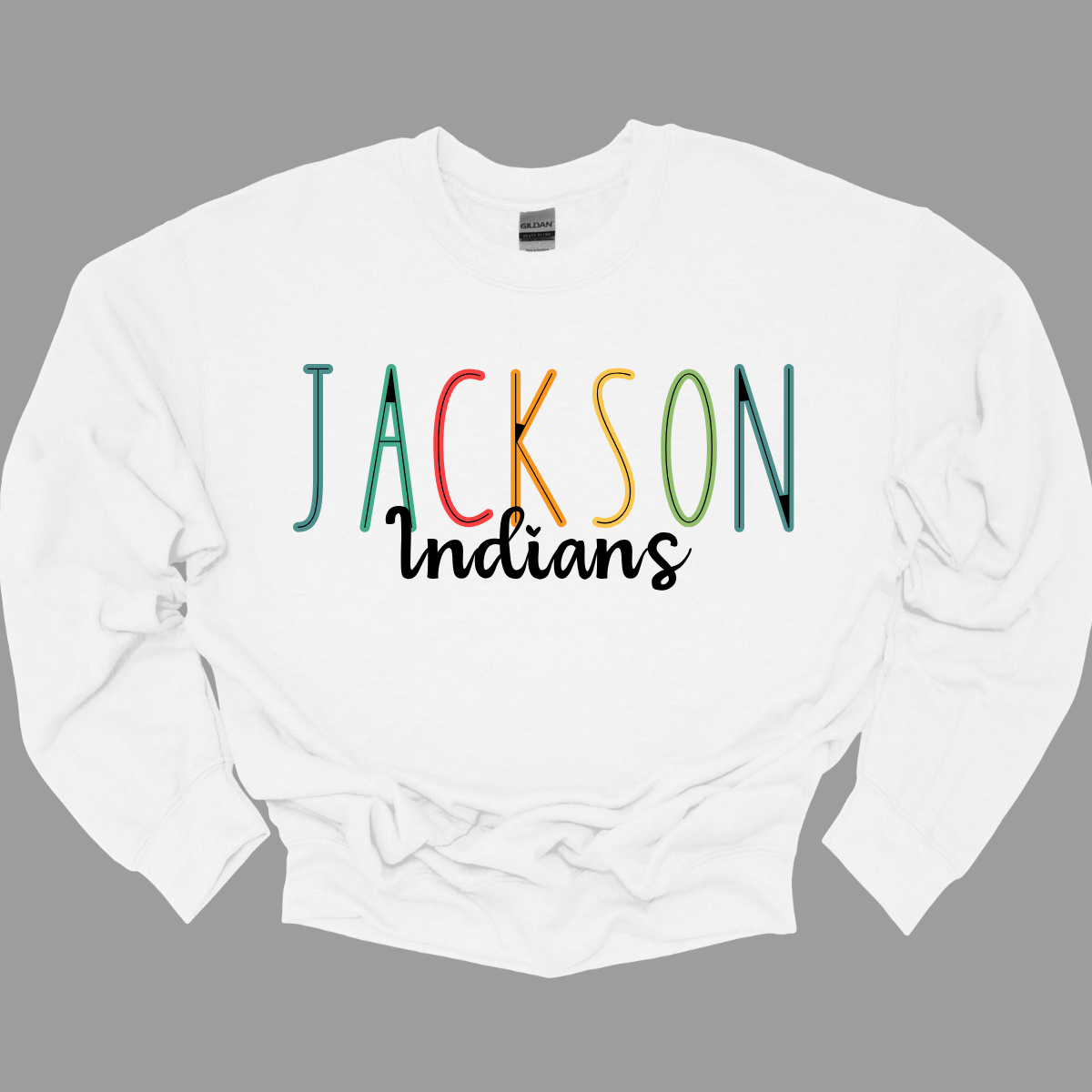 Show your Jackson pride with our vibrant Jackson Indians Spiritwear T-shirt! This eye-catching design features "Jackson" prominently highlighted in a spectrum of bold, dynamic colors, showcasing your school spirit in every shade. The word "Indians" is elegantly scripted in black cursive, adding a touch of classic sophistication to this spirited tee. Shop at Gorgeousware.com