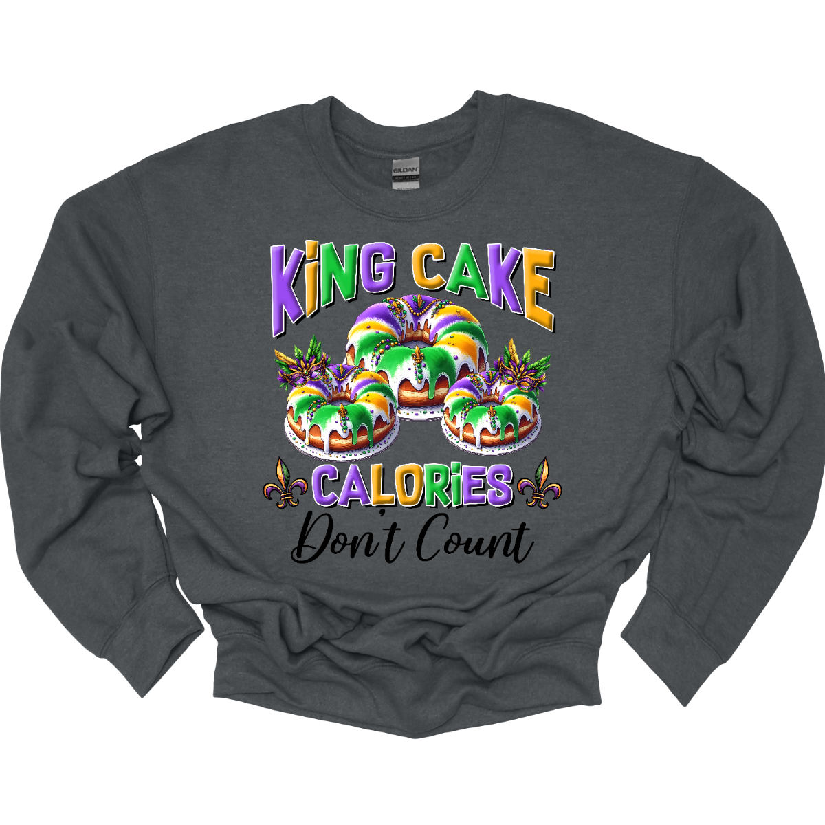 Indulge guilt-free in the sweet delights of Mardi Gras with our 'King Cake Calories Don't Count' t-shirt! Adorned with a whimsical king cake design, this shirt embodies the spirit of celebration and indulgence that defines the season. Whether you're savoring the cinnamon-infused layers of pastry or eagerly searching for the hidden baby, this shirt is a playful reminder that during Mardi Gras, calories simply don't matter Shop at Gorgeousware.com