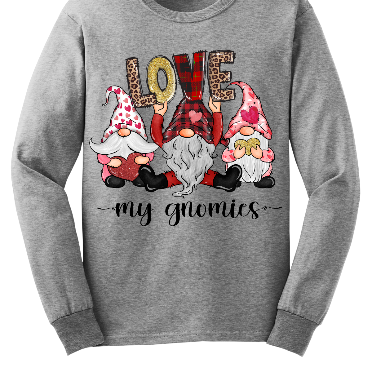 Introducing our "Love My Gnomies" T-shirt – a heartwarming and whimsical garment that celebrates the joy of friendship with three adorable gnomes holding up the word "love." This shirt is a delightful expression of love and camaraderie perfect for Valentine's Day. The design features three adorable gnomes, holding up the word "love," creating a cute and charming scene. Shop at Gorgeousware.com