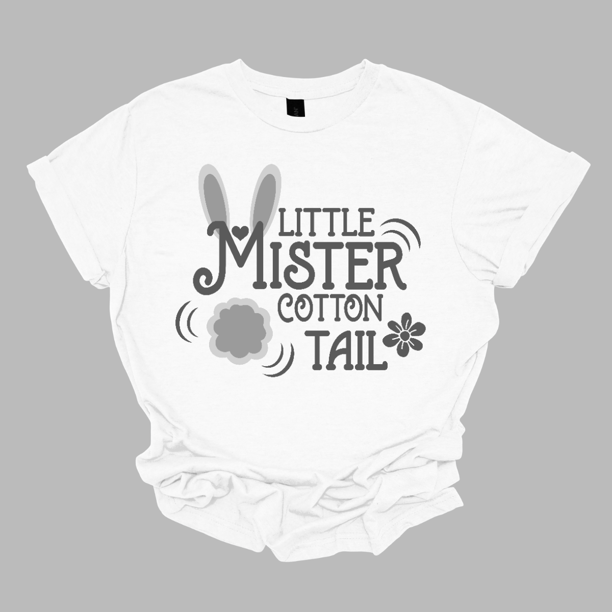 Introducing our adorable 'Little Mr. Cottontail' T-shirt, where the 'M' is adorned with bunny ears and a cotton tail, transforming it into a charming bunny rabbit! Perfect for the little ones who embody the spirit of Easter with their boundless energy and playful nature. Shop now at Gorgeousware.com