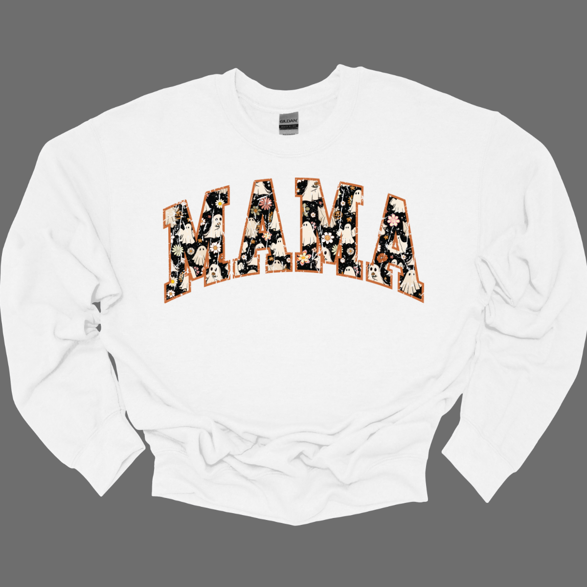 Embrace the season with our Retro 'MAMA' tee, where vintage vibes meet whimsical charm! This shirt features the word 'MAMA' in a playful retro font, adorned with an enchanting pattern of cute ghosts and autumn florals. Each letter is a delightful mix of spooky and sweet, showcasing tiny, friendly ghosts amidst vibrant fall blooms. Crafted from soft, high-quality fabric, this tee is perfect for adding a touch of seasonal spirit to your wardrobe. Shop at Gorgeousware.com
