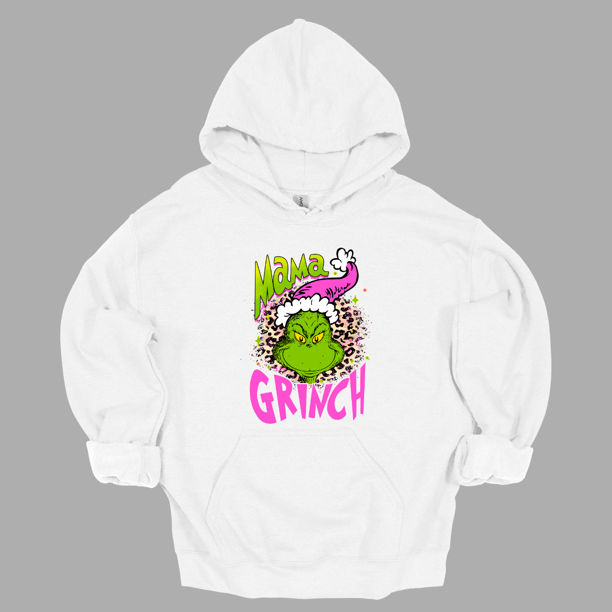 At the center of the design is the phrase "Mama Grinch," rendered in a whimsical, Grinch-style font. The word "Mama" pops in a vibrant green color with a delicate pink shadow that adds a touch of charm. The word "Grinch" contrasts in a bold, eye-catching pink that stands out against the green. Between the two words, there's a delightful illustration of the Grinch himself. He's sporting a cute pink and white Santa hat, which adds a fun and seasonal flair. Shop Gorgeousware.com
