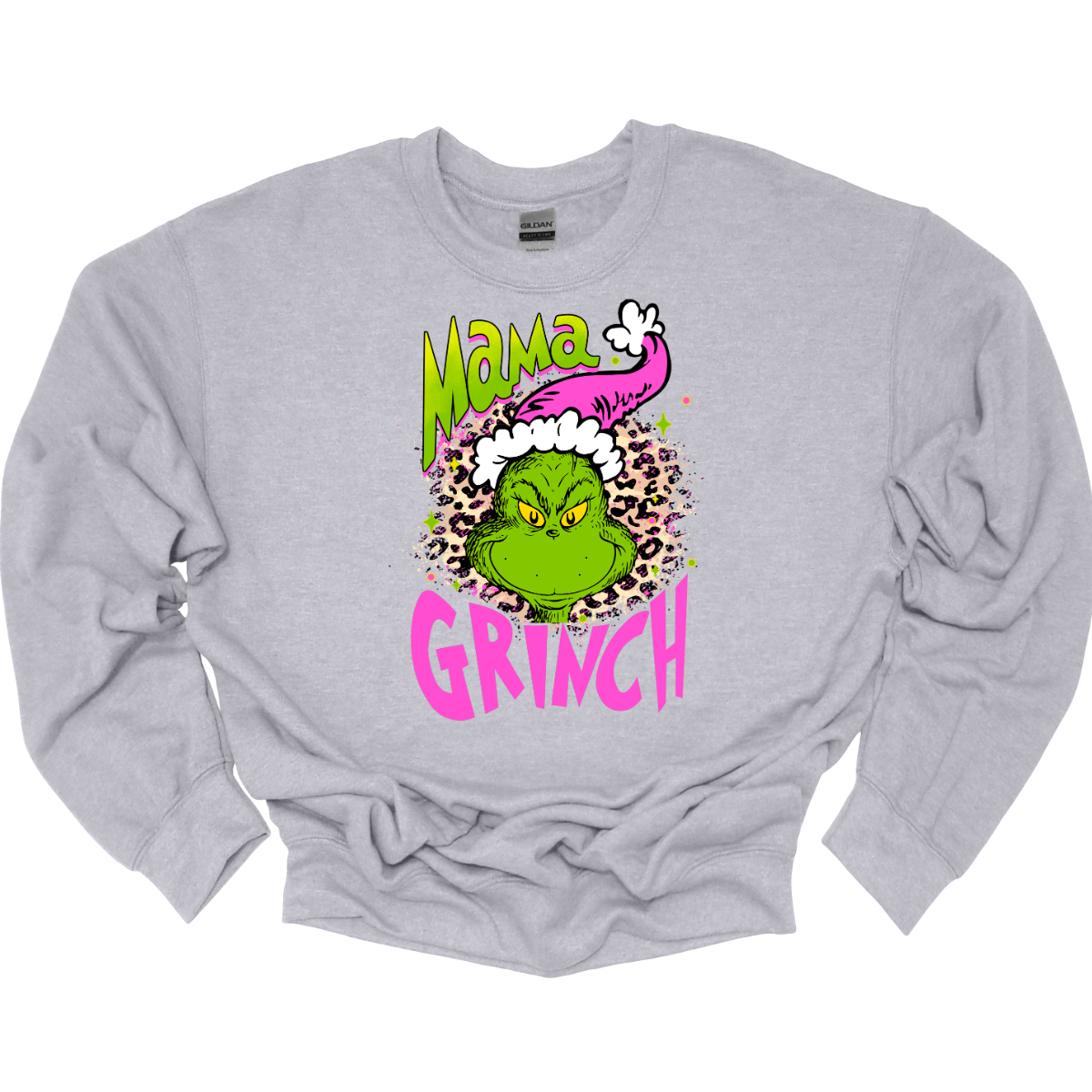 At the center of the design is the phrase "Mama Grinch," rendered in a whimsical, Grinch-style font. The word "Mama" pops in a vibrant green color with a delicate pink shadow that adds a touch of charm. The word "Grinch" contrasts in a bold, eye-catching pink that stands out against the green. Between the two words, there's a delightful illustration of the Grinch himself. He's sporting a cute pink and white Santa hat, which adds a fun and seasonal flair. Shop Gorgeousware.com