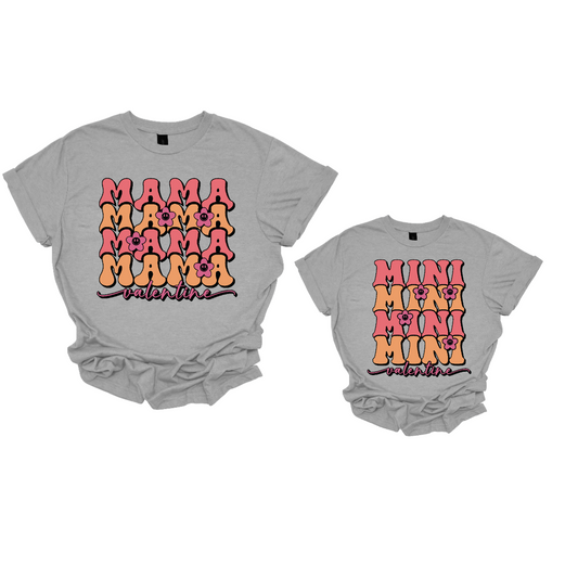 Spread the love in style with our 'Mama Valentine' and 'Mini Valentine' matching T-shirts, adorned with delightful little flowers. Crafted for comfort and charm, these coordinating tees celebrate the sweet bond between mother and child. The dainty flowers add a touch of elegance and joy to the design, making them perfect for any Valentine's Day celebration.