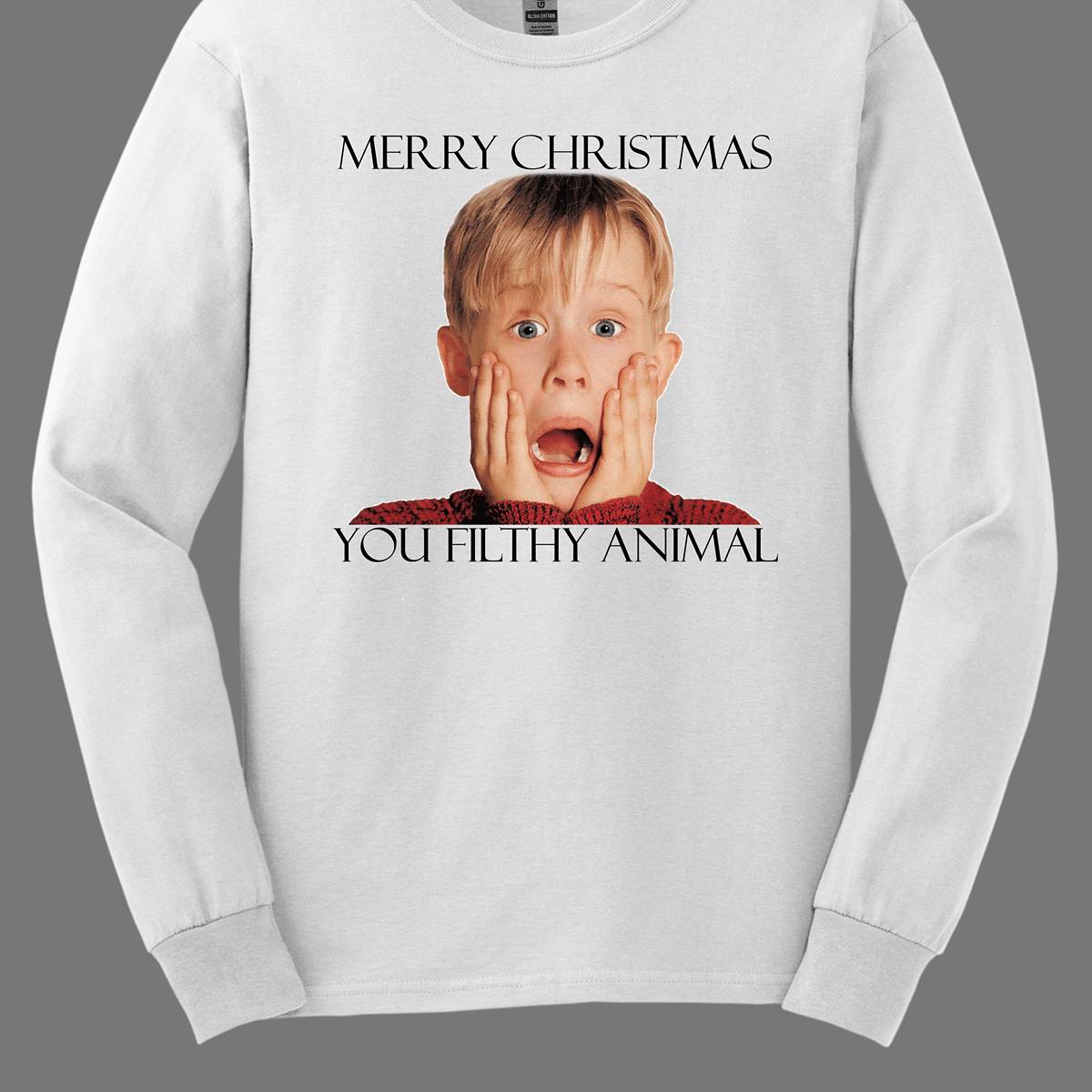 This fun and festive apparel features the iconic phrase "Merry Christmas You Filthy Animal" in bold, playful lettering, a memorable line from the Home Alone movie. The design also showcases the infamous face of Kevin McCallister, played by Macaulay Culkin, with his hands on his cheeks in a dramatic, surprised expression. Perfect for any Home Alone fan, this shirt or sweatshirt is ideal for spreading some holiday cheer and nostalgia. Shop at Gorgeousware.com