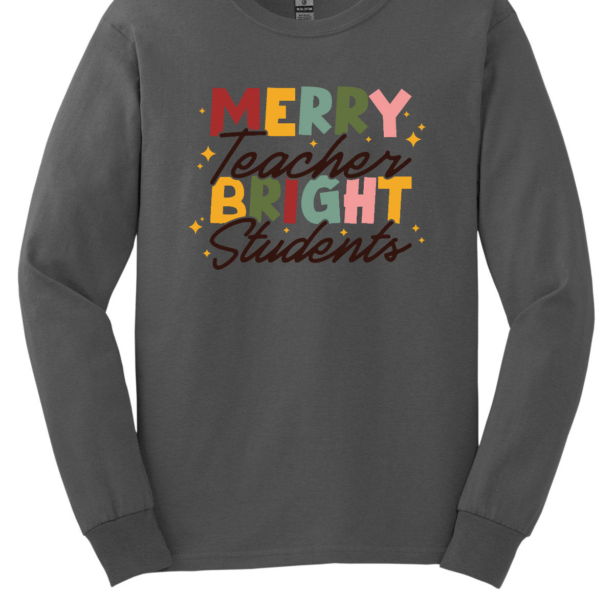 This festive t-shirt showcases the cheerful phrase "Merry Teacher Bright Students" in a delightful design. The words "MERRY" and "BRIGHT" are prominently featured in a blocky yet playful font, with each letter bursting in a vibrant mix of shades of green and red, evoking the spirit of the holiday season. Shop Gorgeousware.com