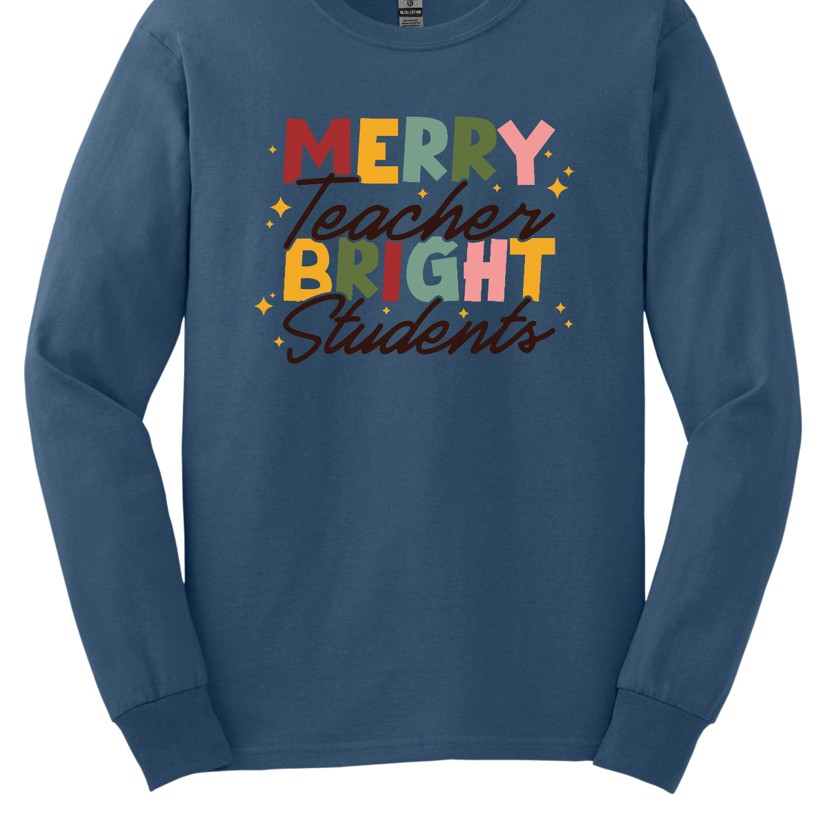 This festive t-shirt showcases the cheerful phrase "Merry Teacher Bright Students" in a delightful design. The words "MERRY" and "BRIGHT" are prominently featured in a blocky yet playful font, with each letter bursting in a vibrant mix of shades of green and red, evoking the spirit of the holiday season. Shop Gorgeousware.com